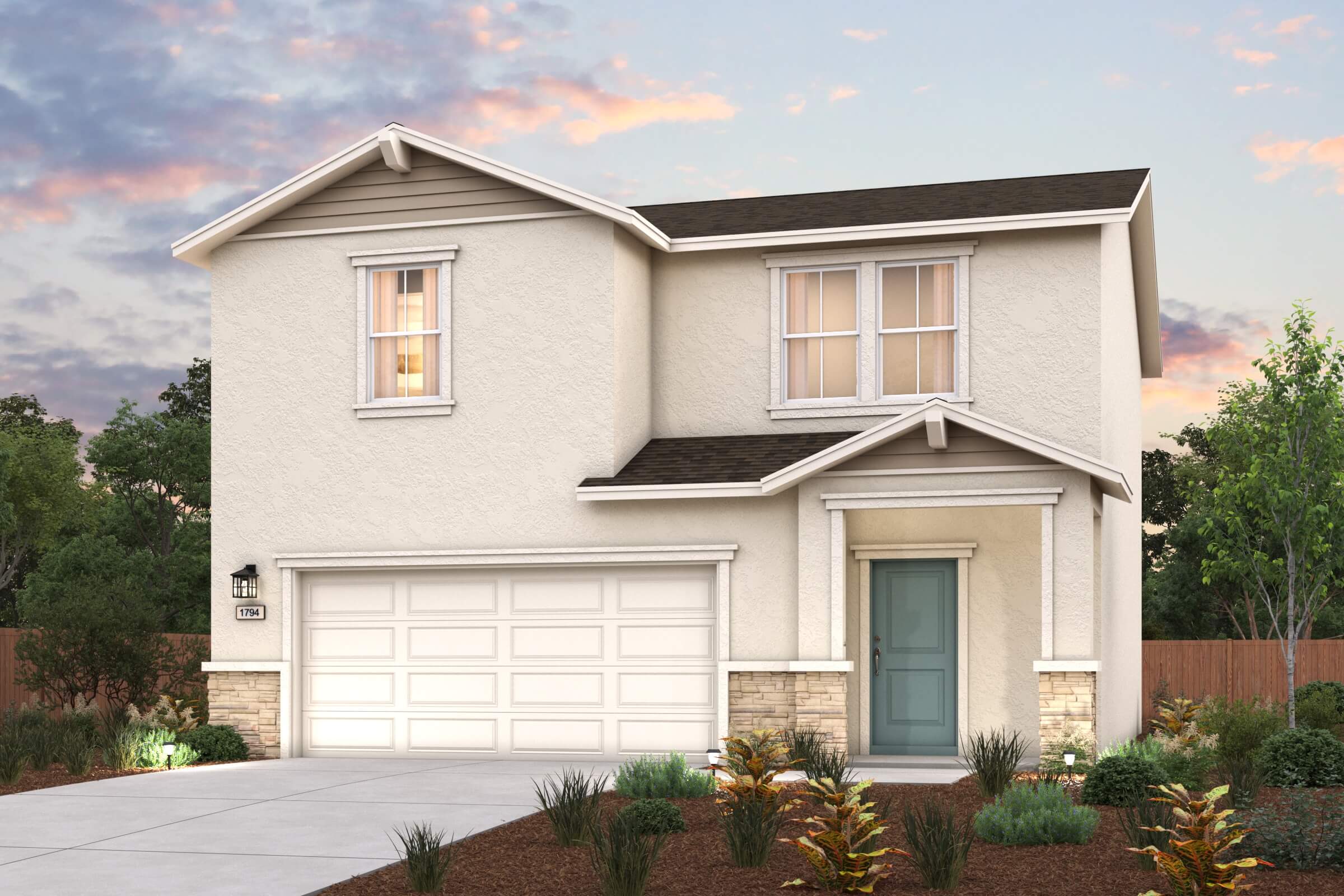 A house with a garage and bushes.