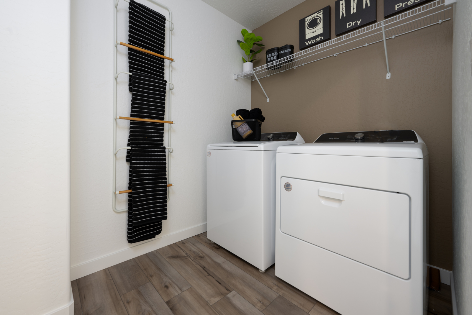 A room with white cabinets and a white machine.