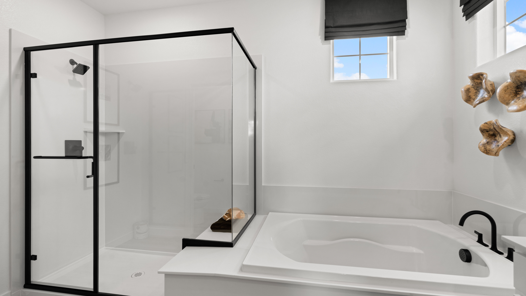 A bathroom with a glass shower.