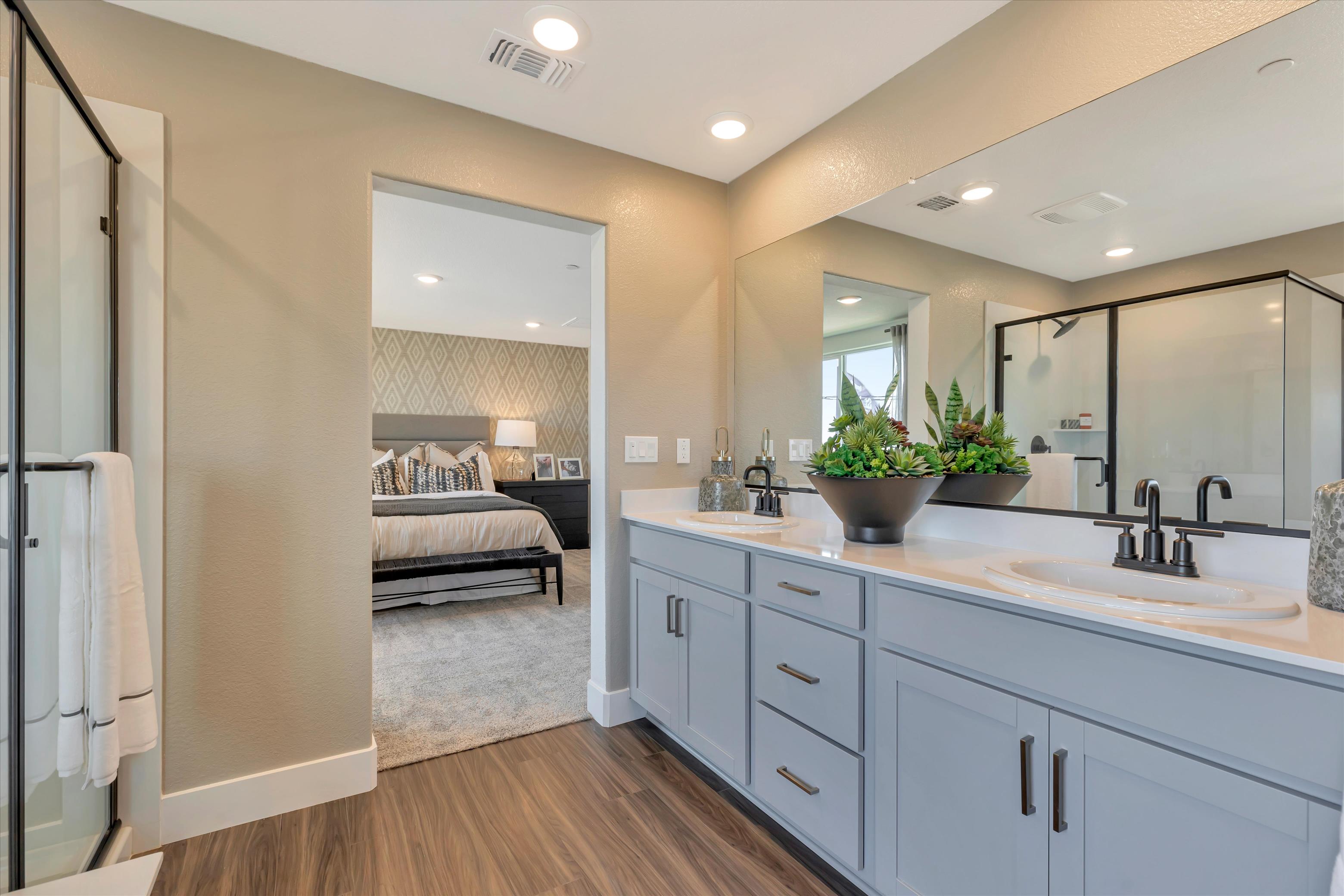 A bathroom with a bed and sink.