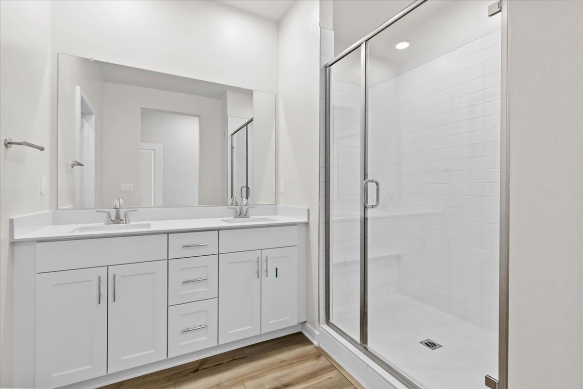 A bathroom with a glass shower.