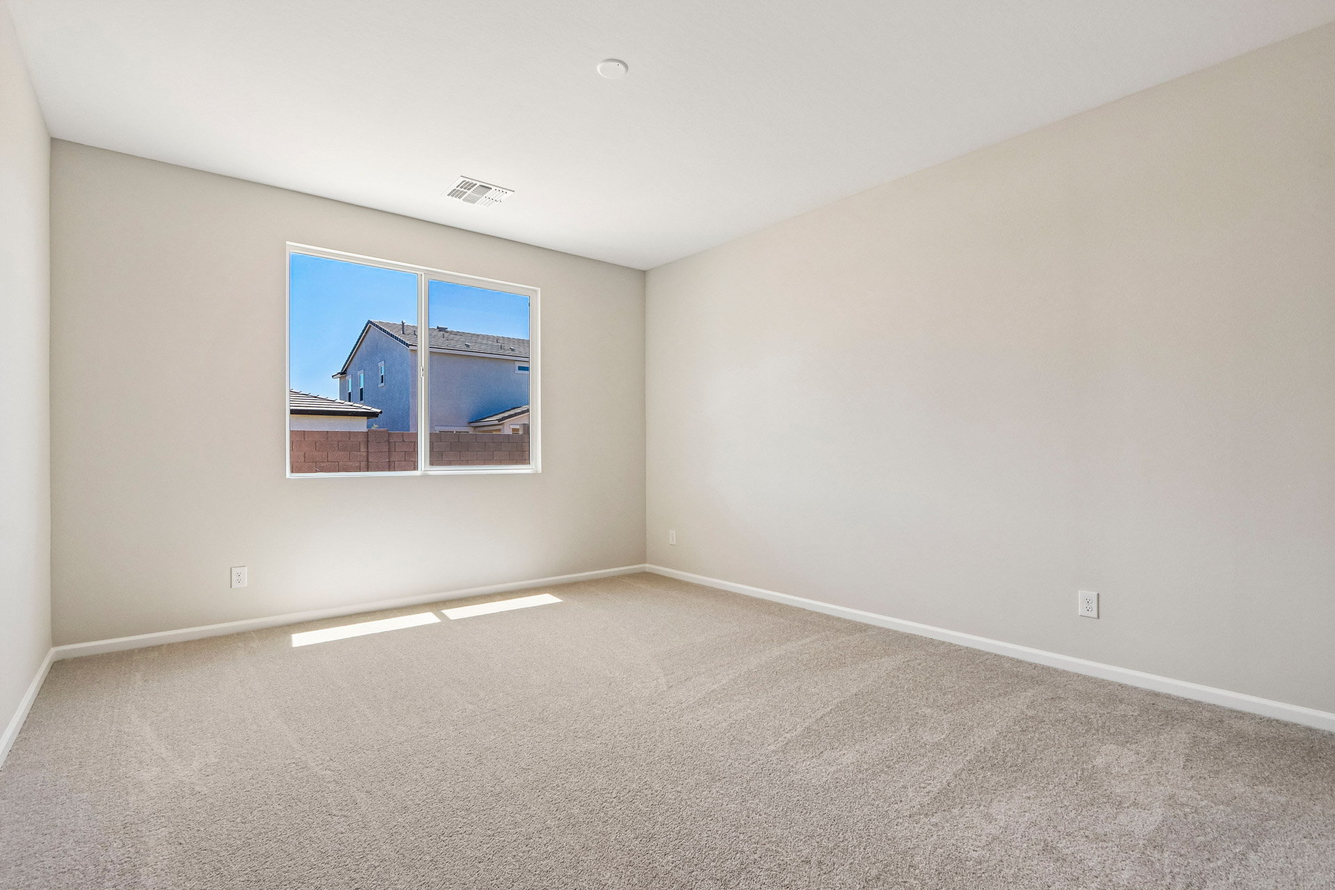 A room with a large painting on the wall.