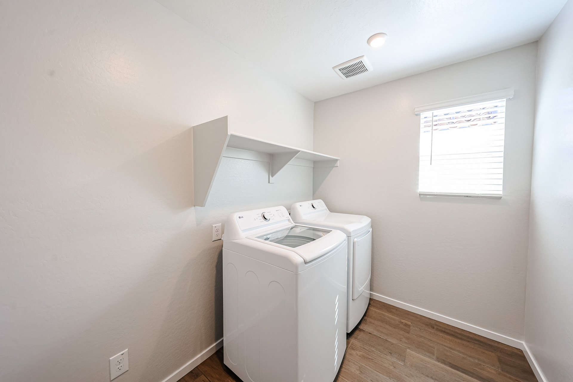 A laundry room with a washer and dryer.