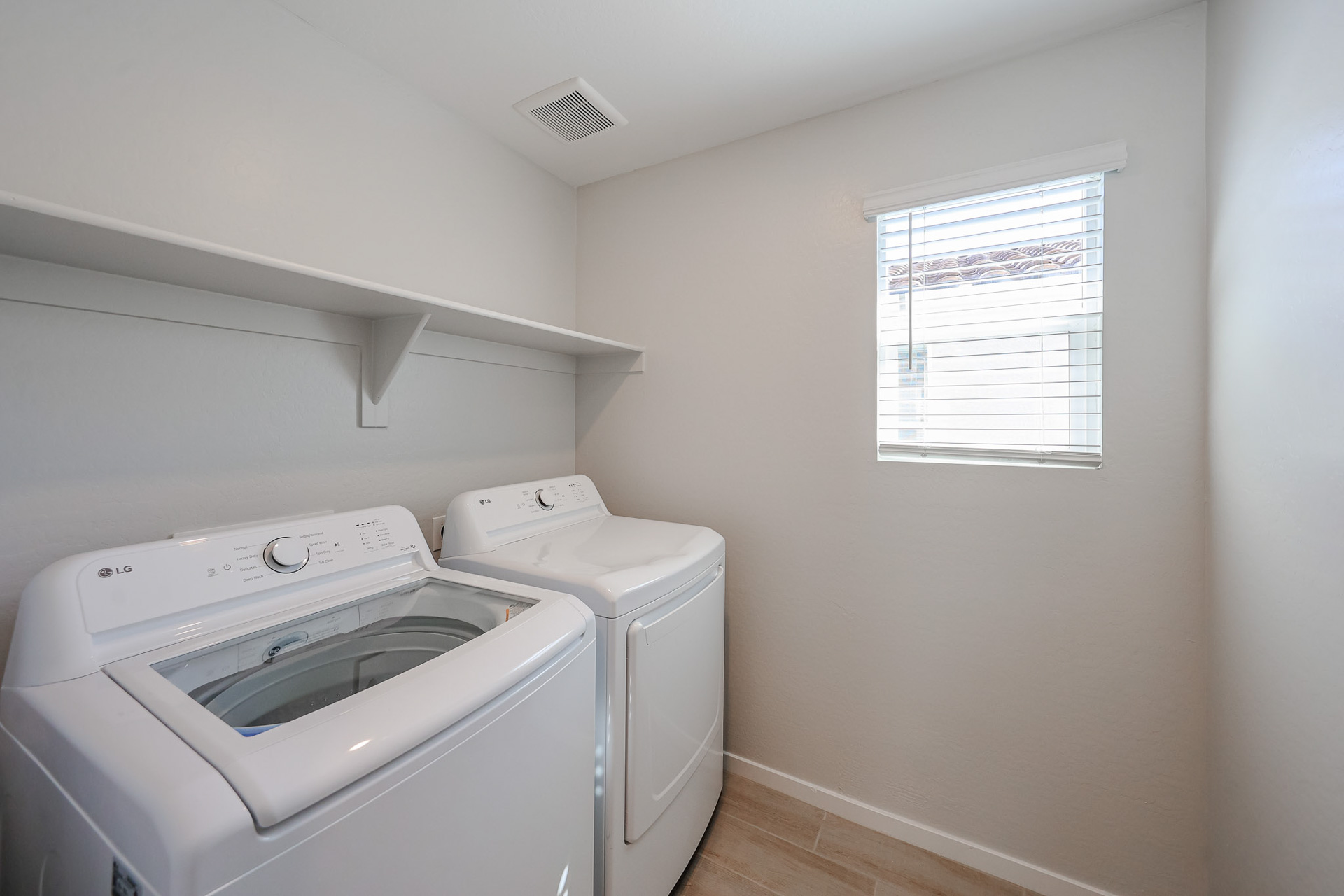 A washing machine in a room.