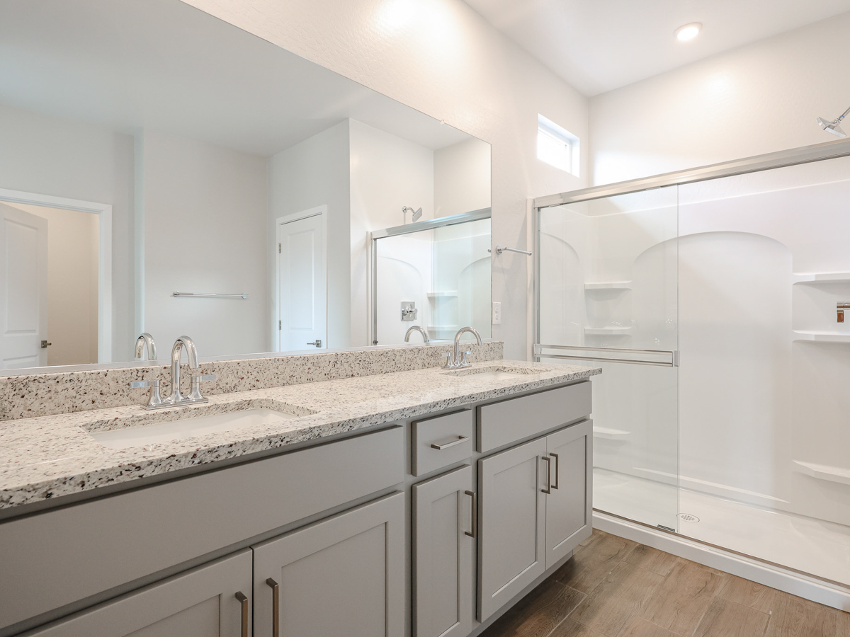 A bathroom with a marble countertop.