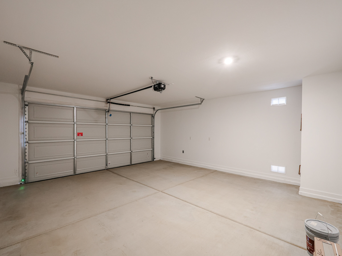A room with a large metal cabinet and a fan.
