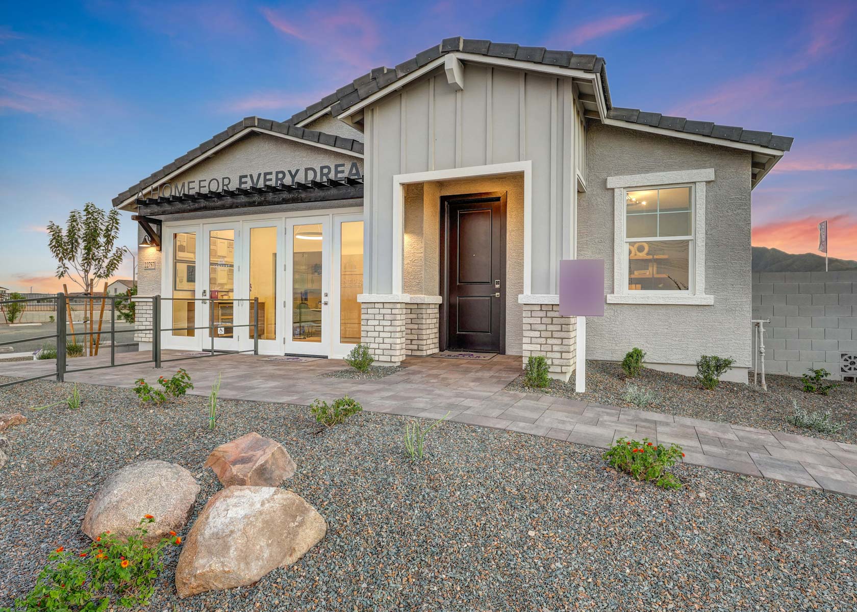 A house with a stone driveway.