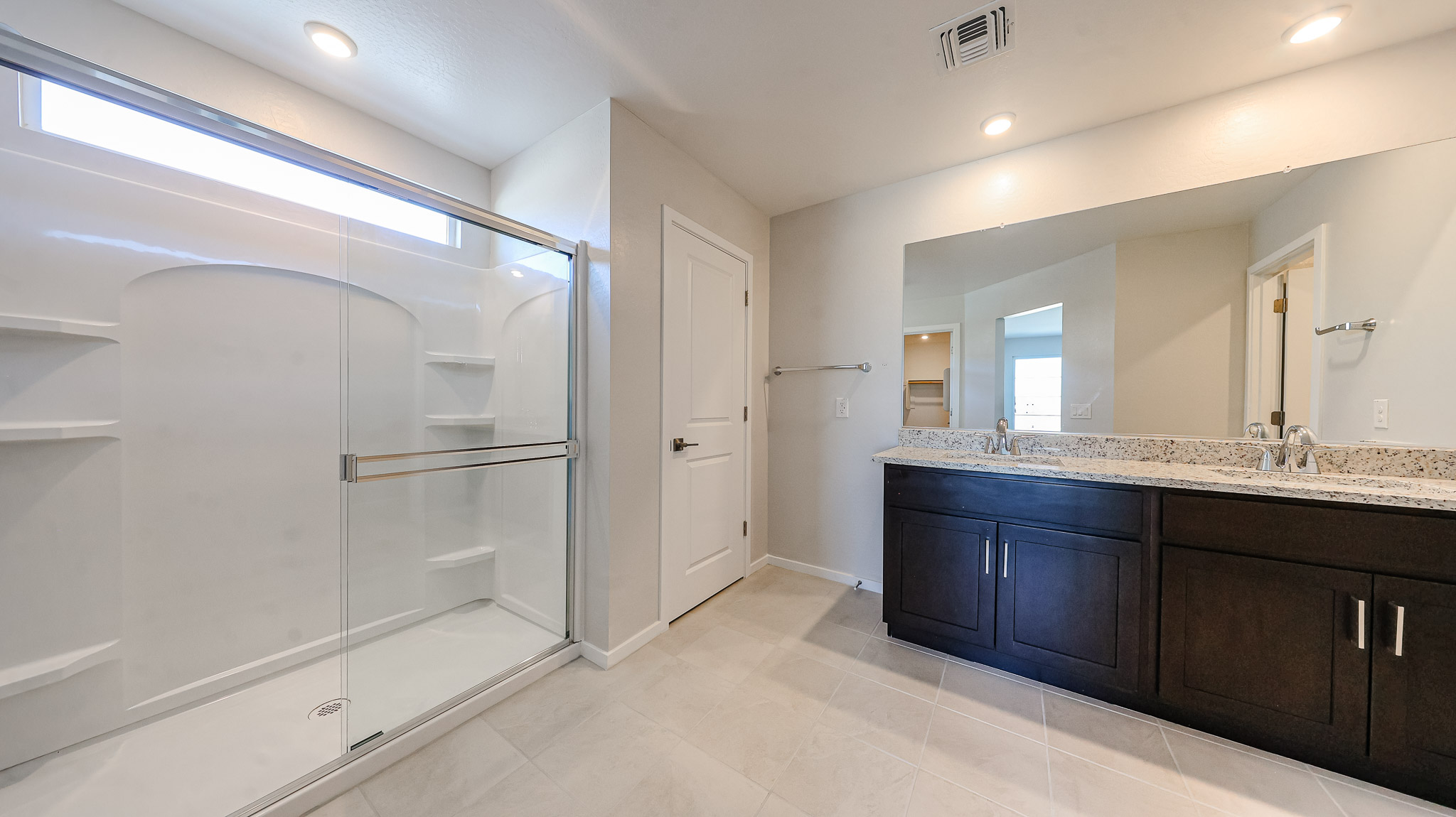 A bathroom with a glass shower.