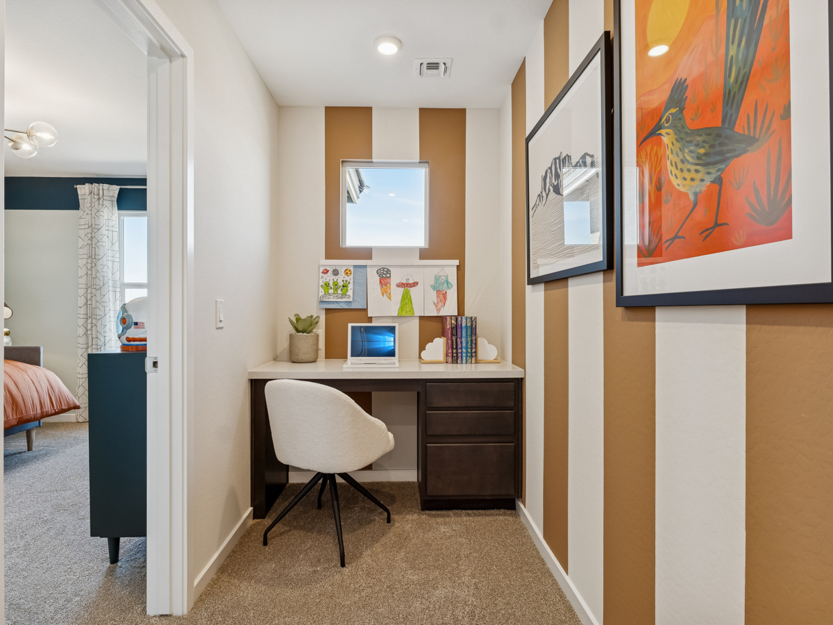 A room with a desk and a chair.