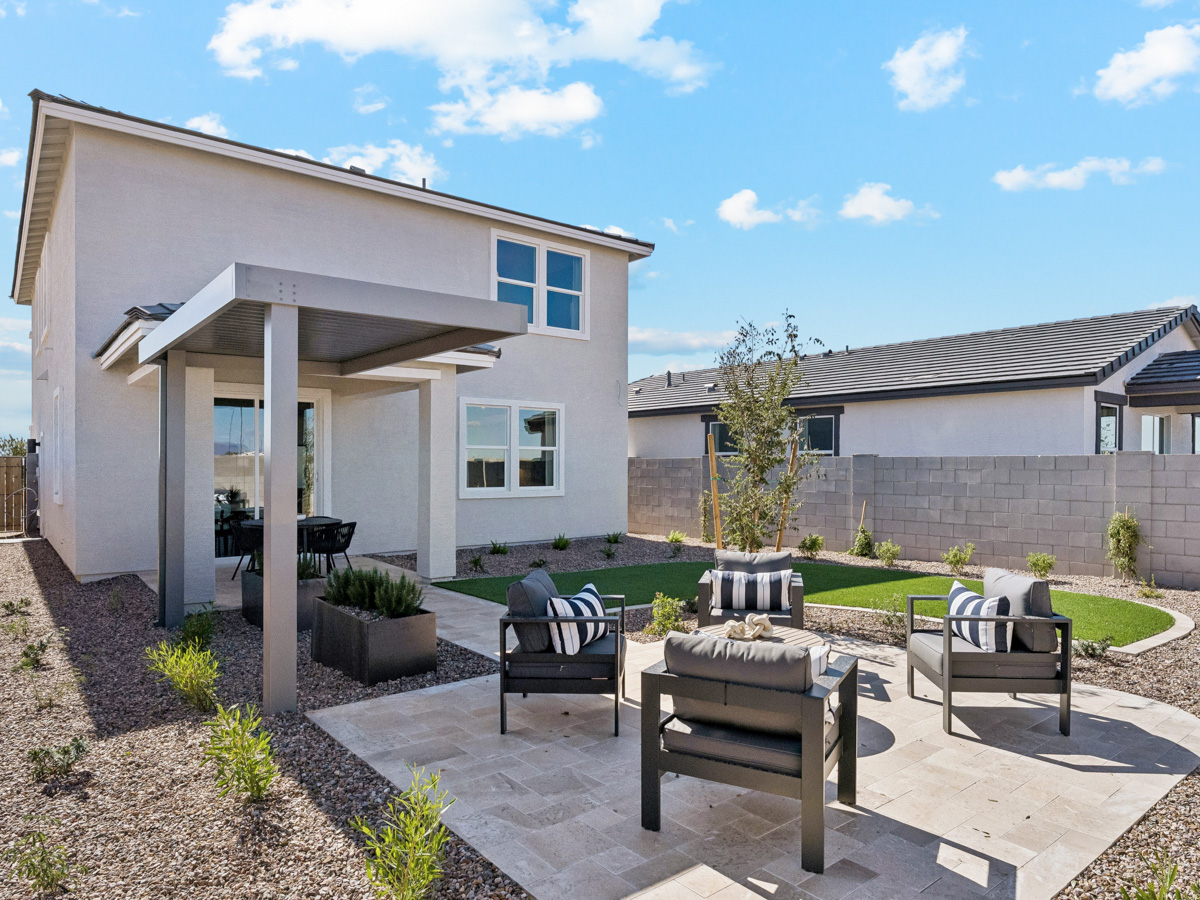 A house with a patio and chairs.