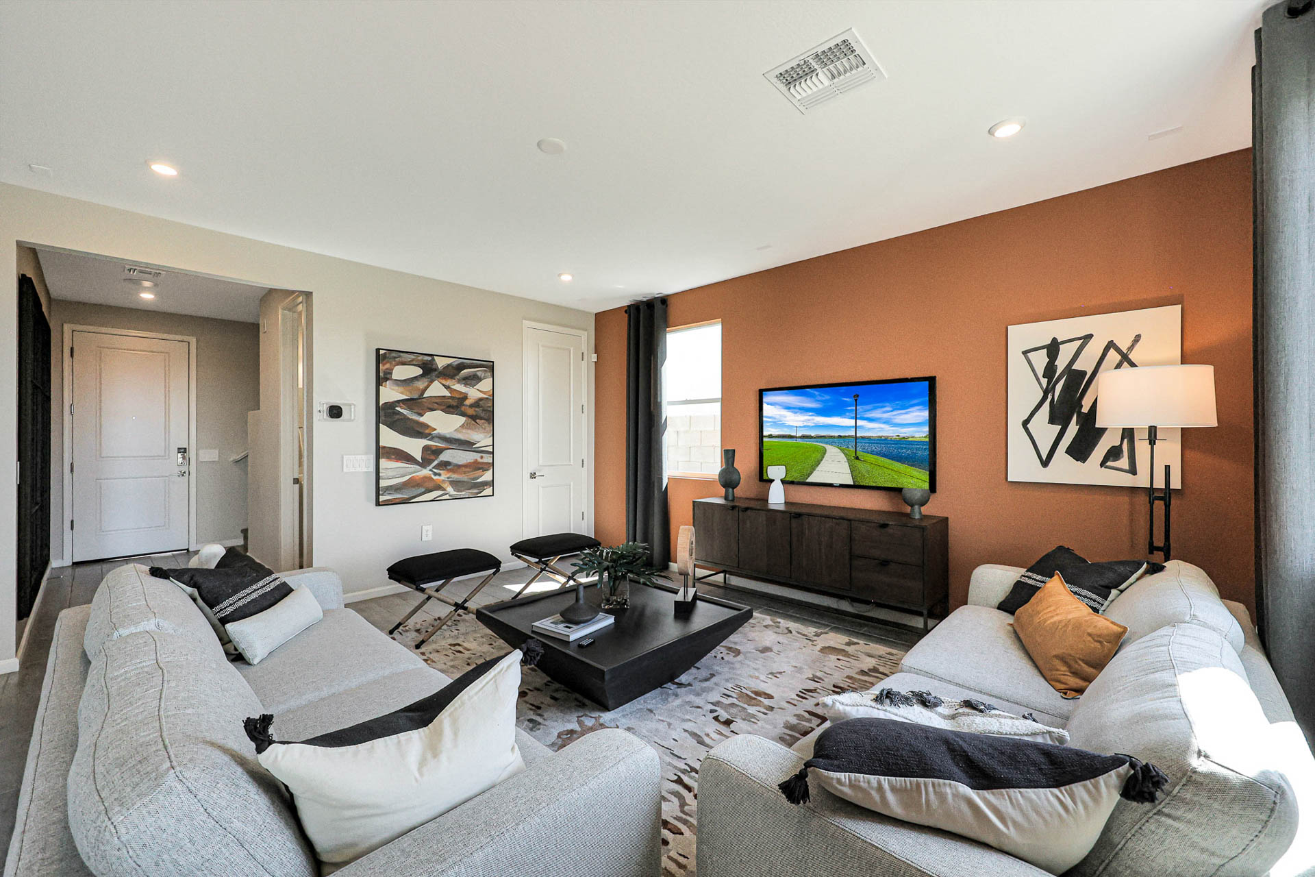 A living room with a tv and couches.