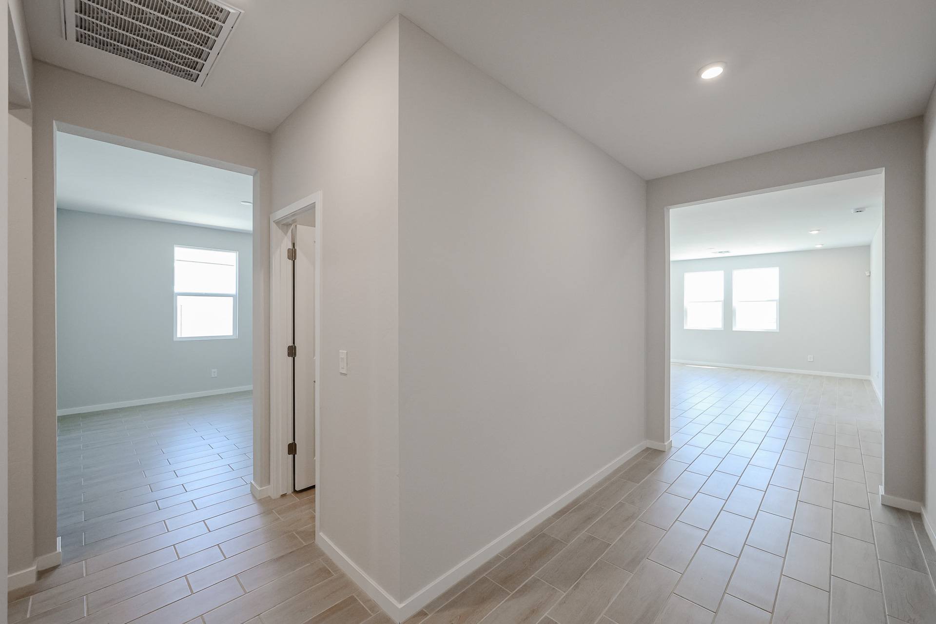 A long hallway with white walls.
