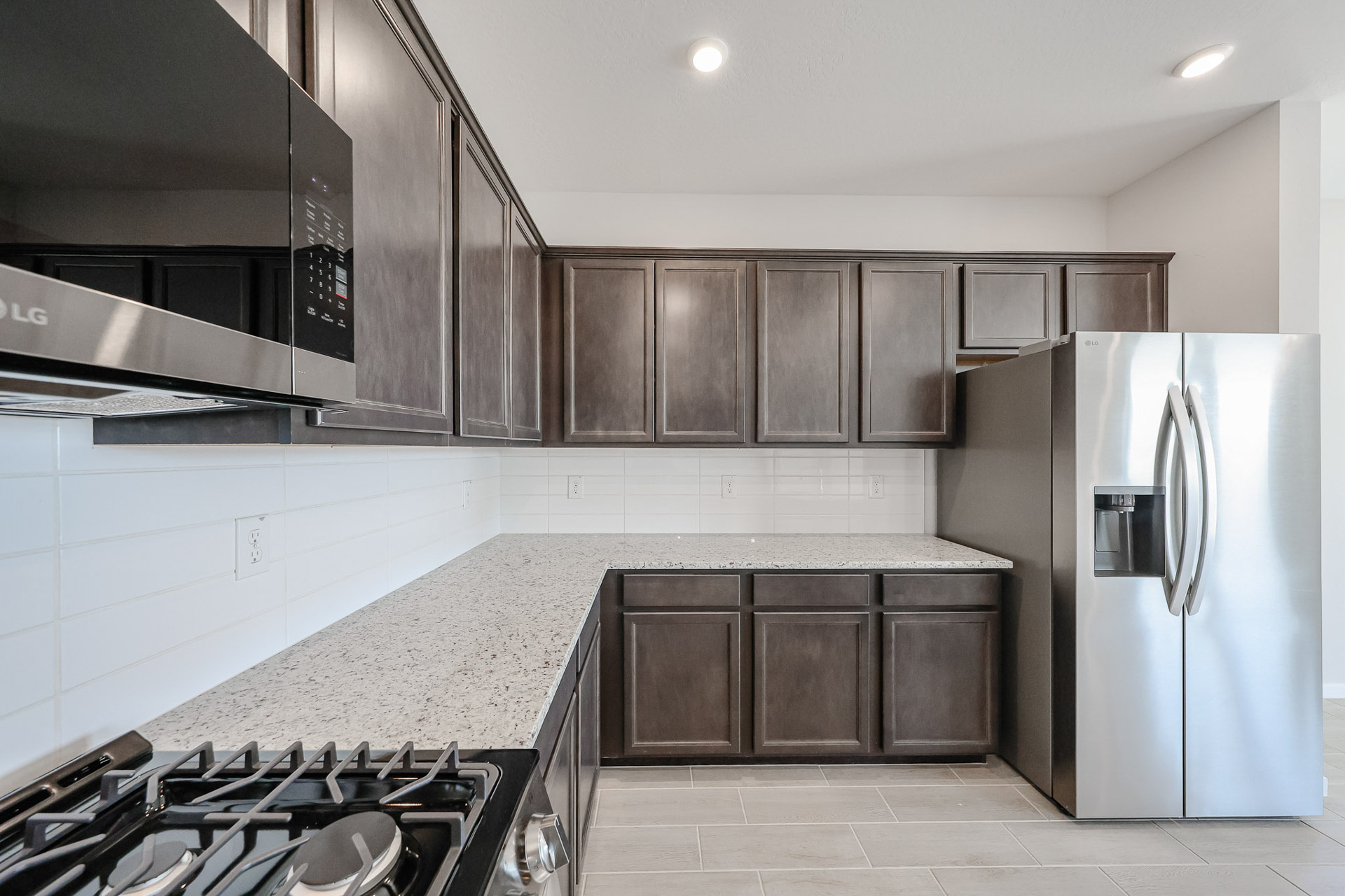 A kitchen with black appliances.