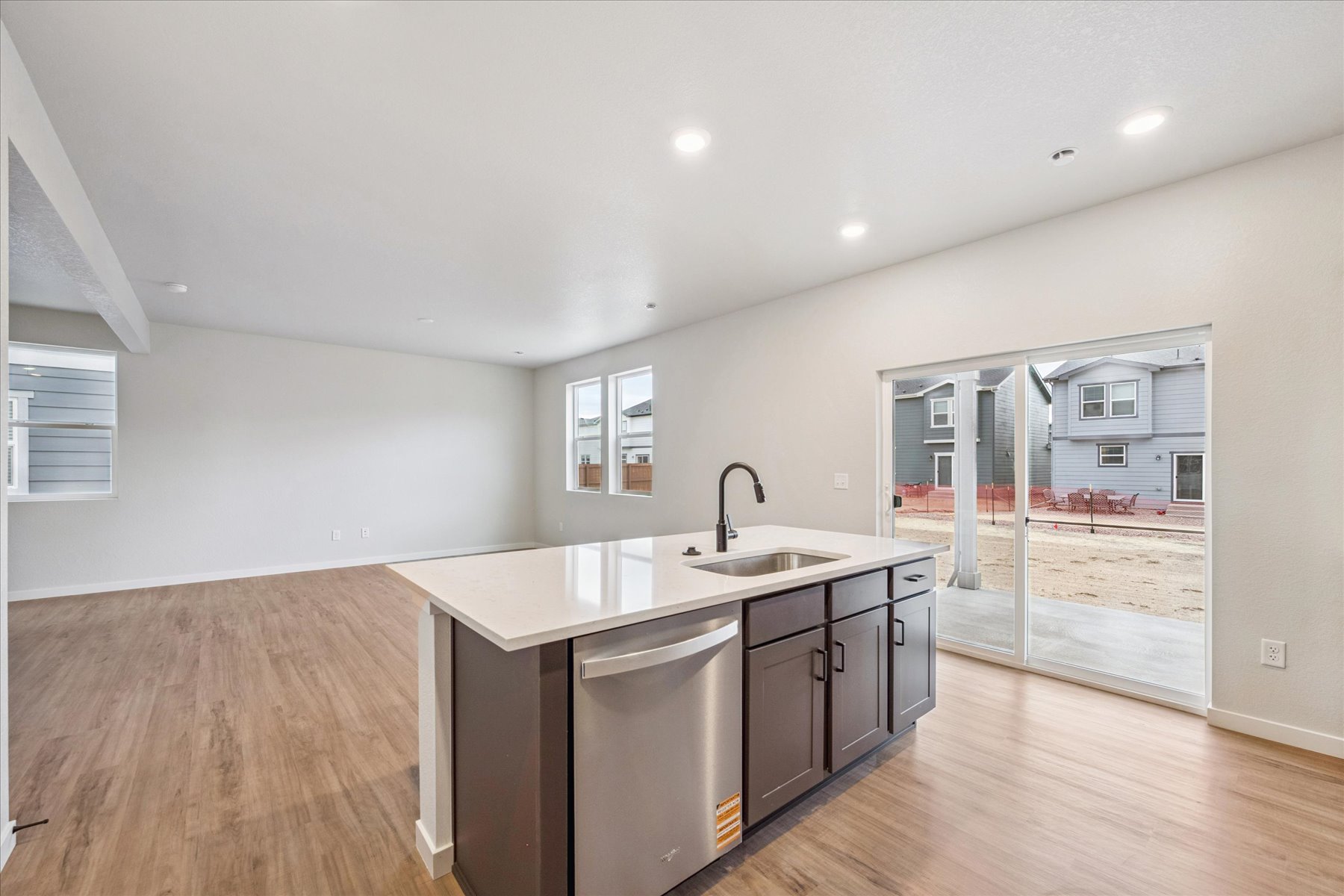 A kitchen with a large glass door.