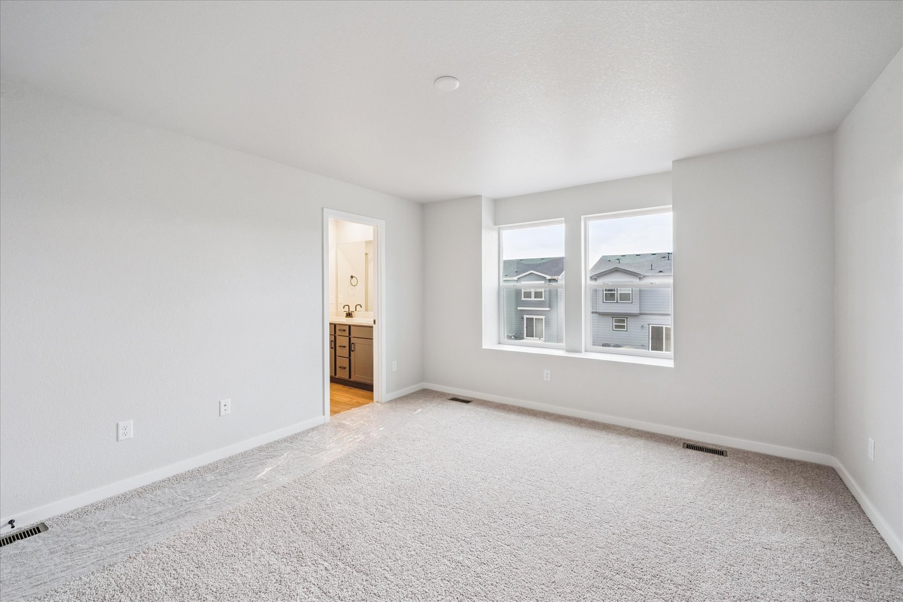 A room with a window and a door.