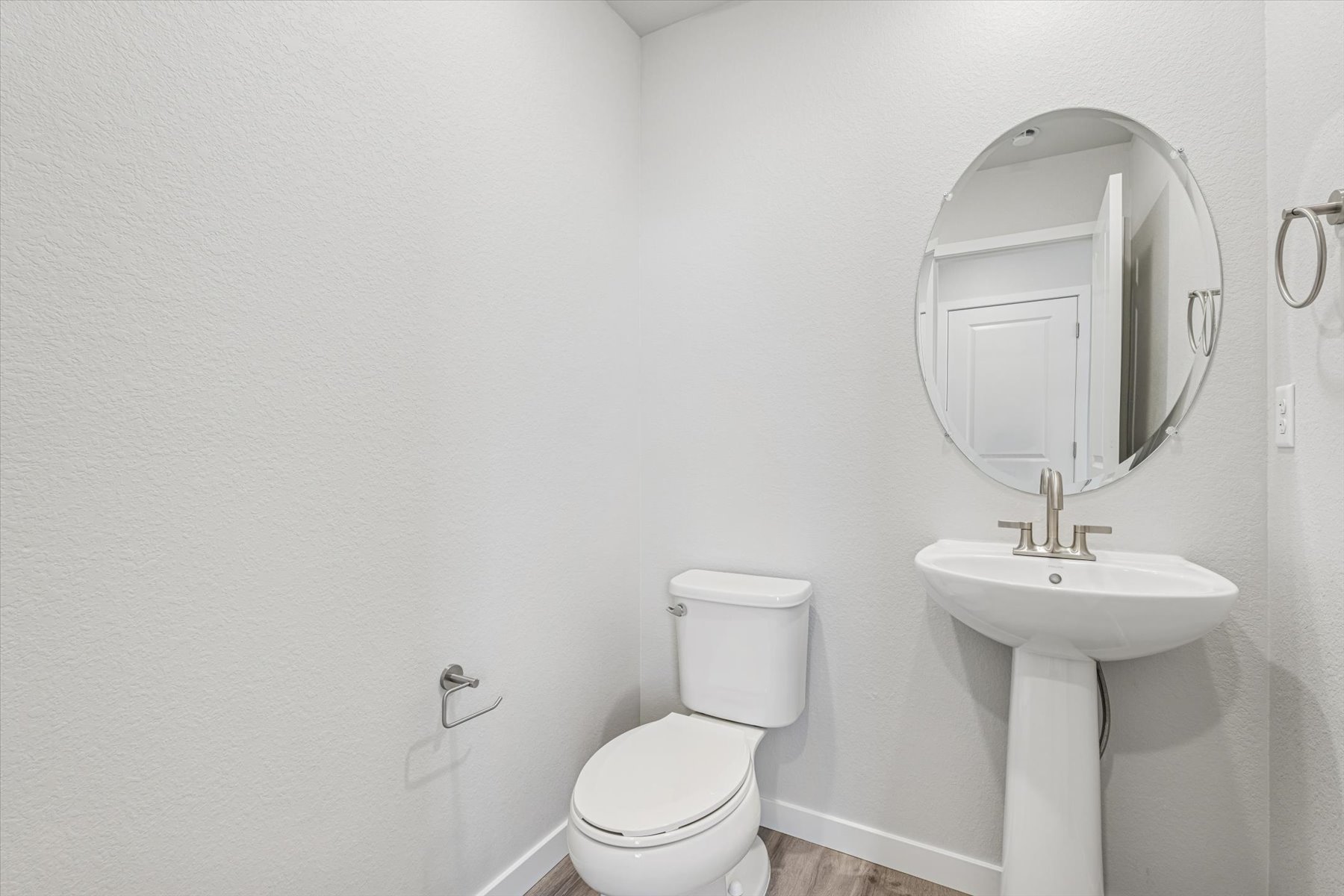 A bathroom with a sink and toilet.