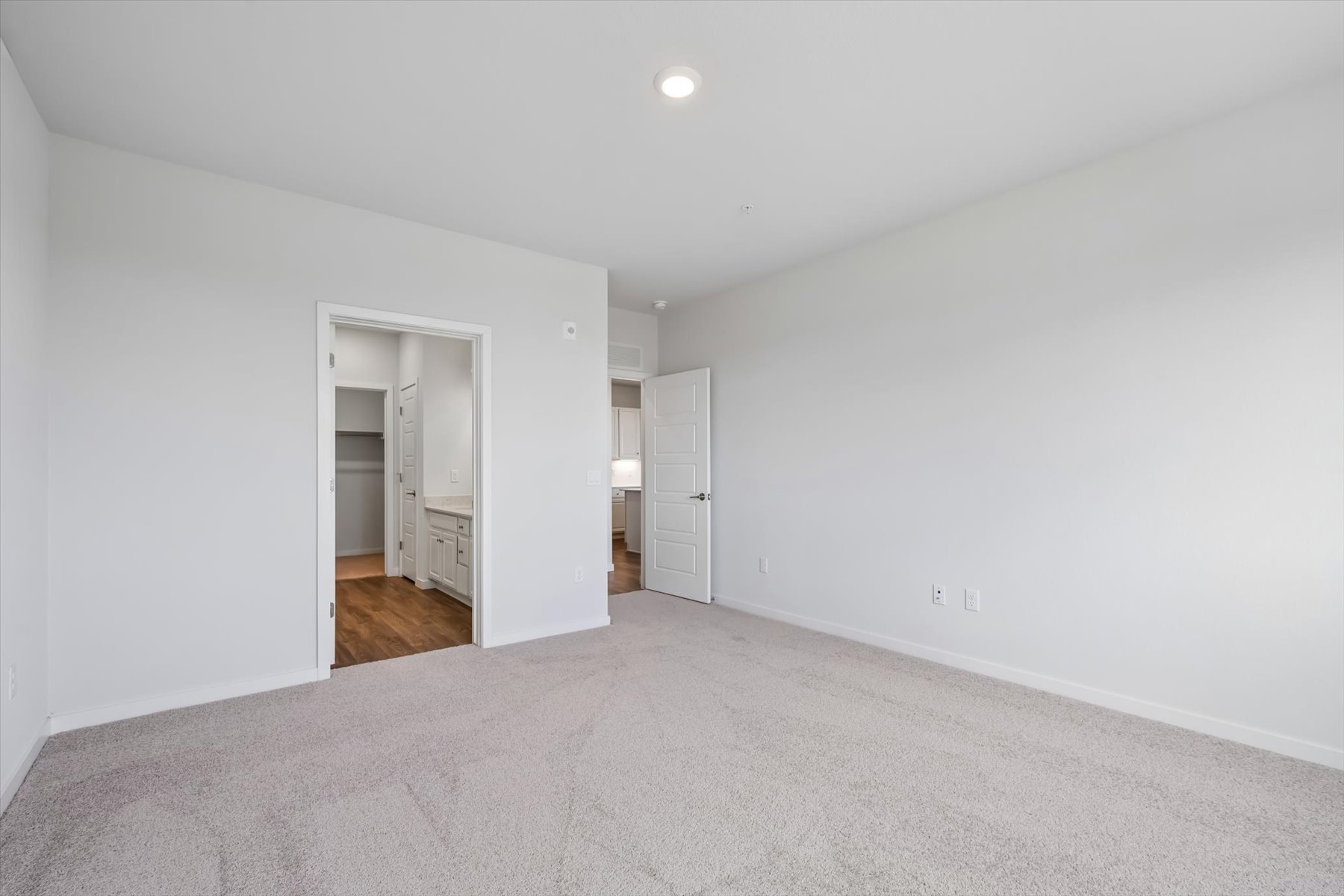 A hallway with white walls.