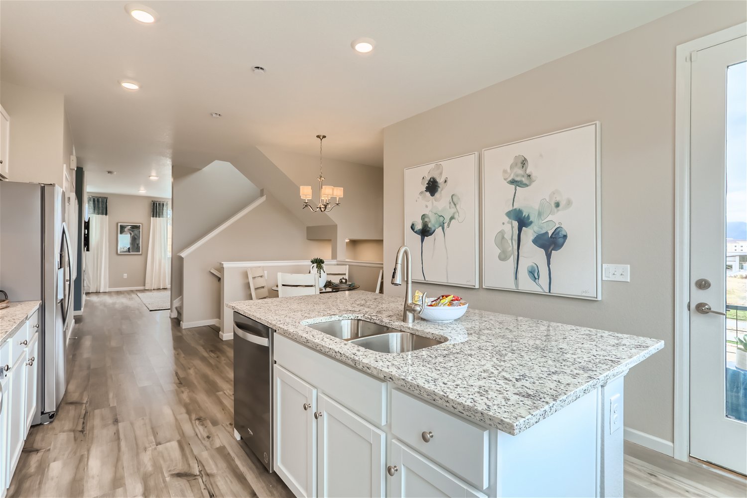 A kitchen with marble counters.
