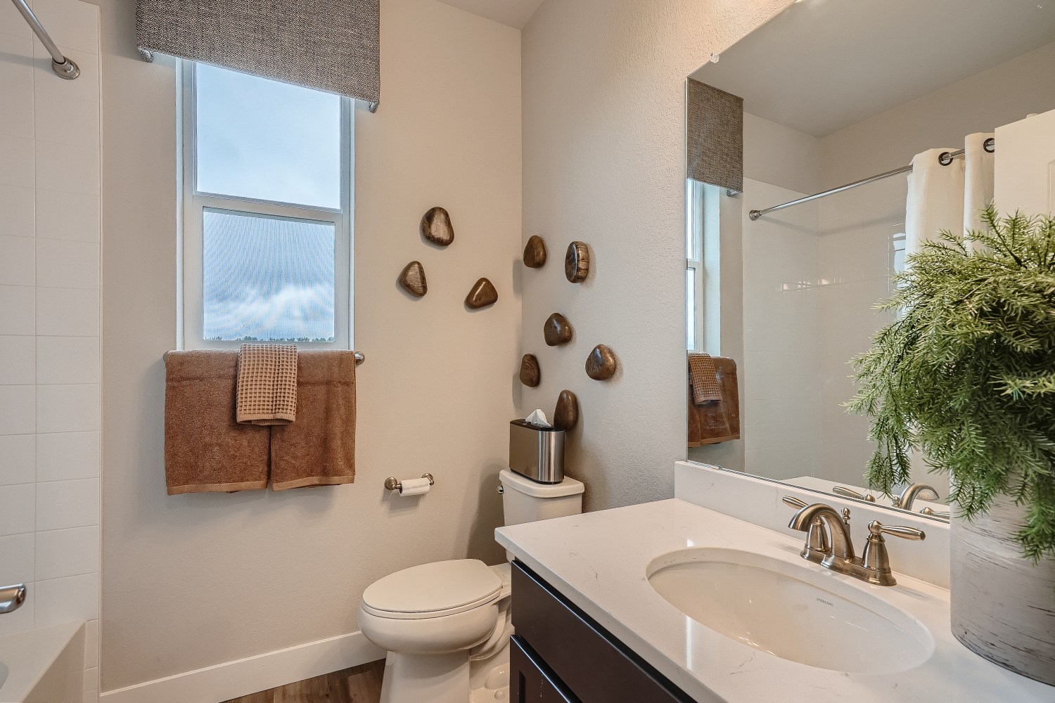 A bathroom with a sink and a toilet.