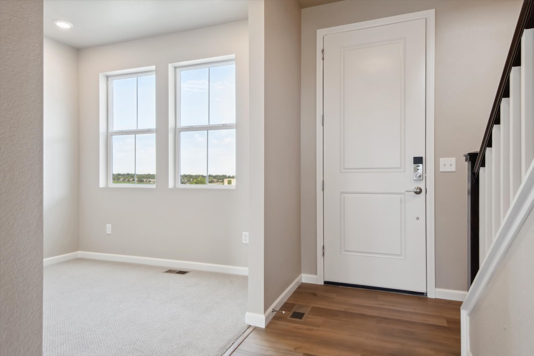 A room with a white door and a white door.