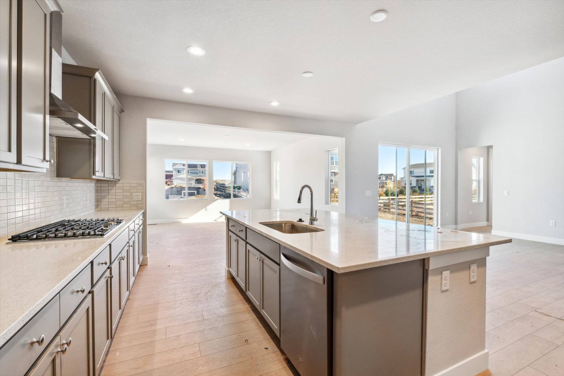 A kitchen with a marble island.