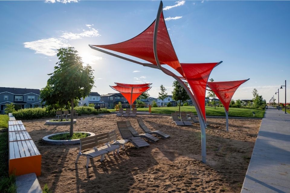 A group of chairs and umbrellas on a beach.