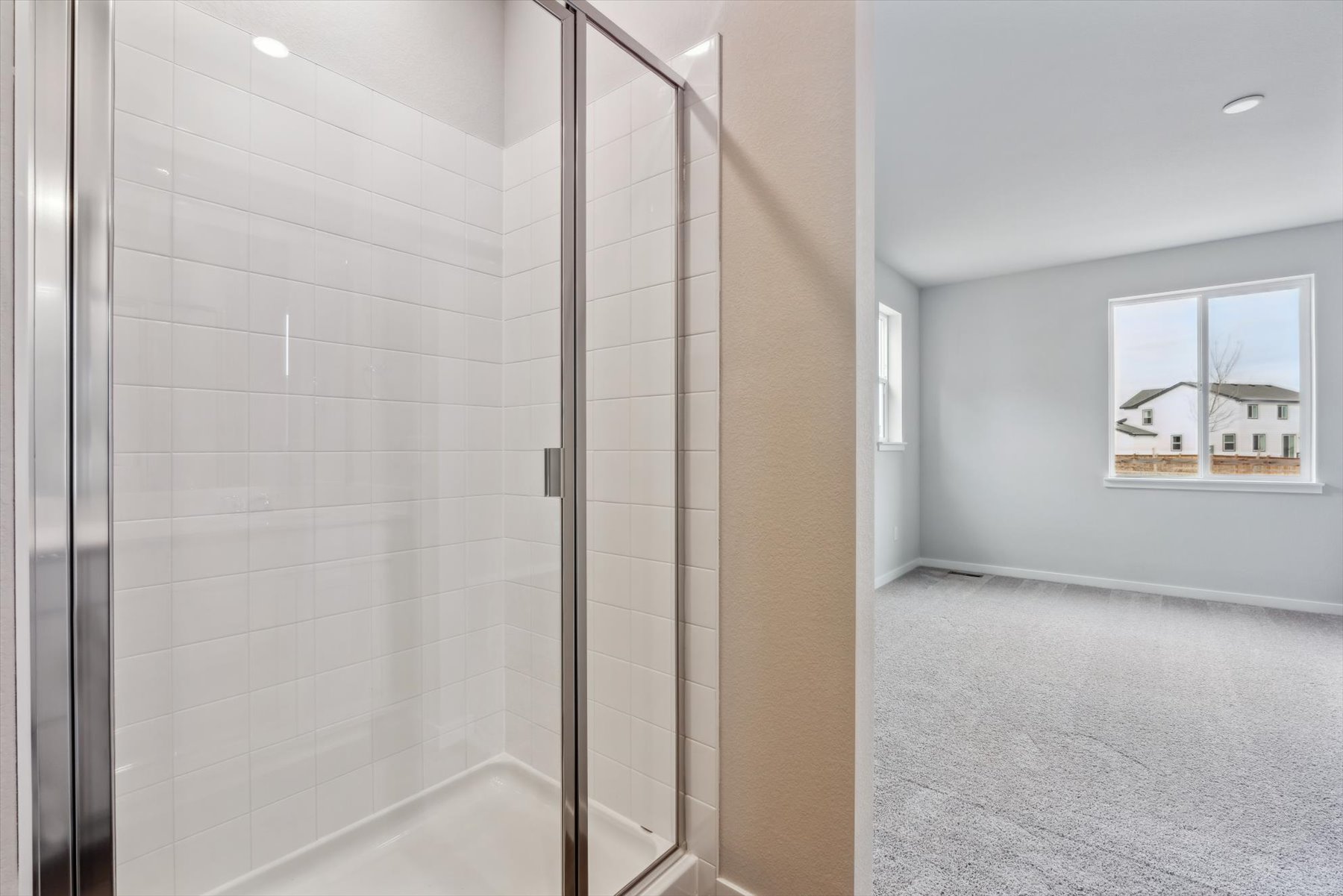 A shower with a glass door.