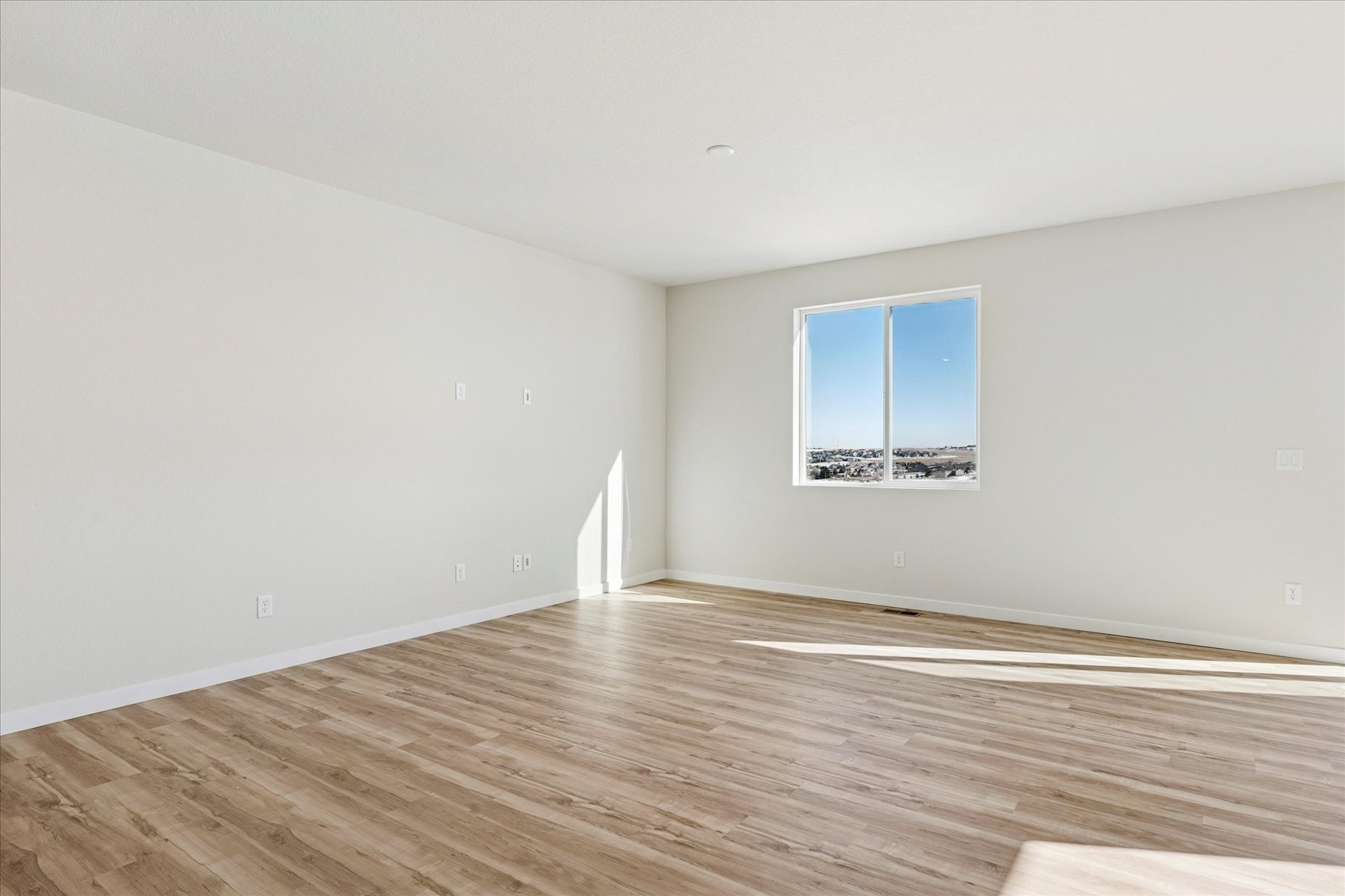 A room with a wood floor and a wood floor.