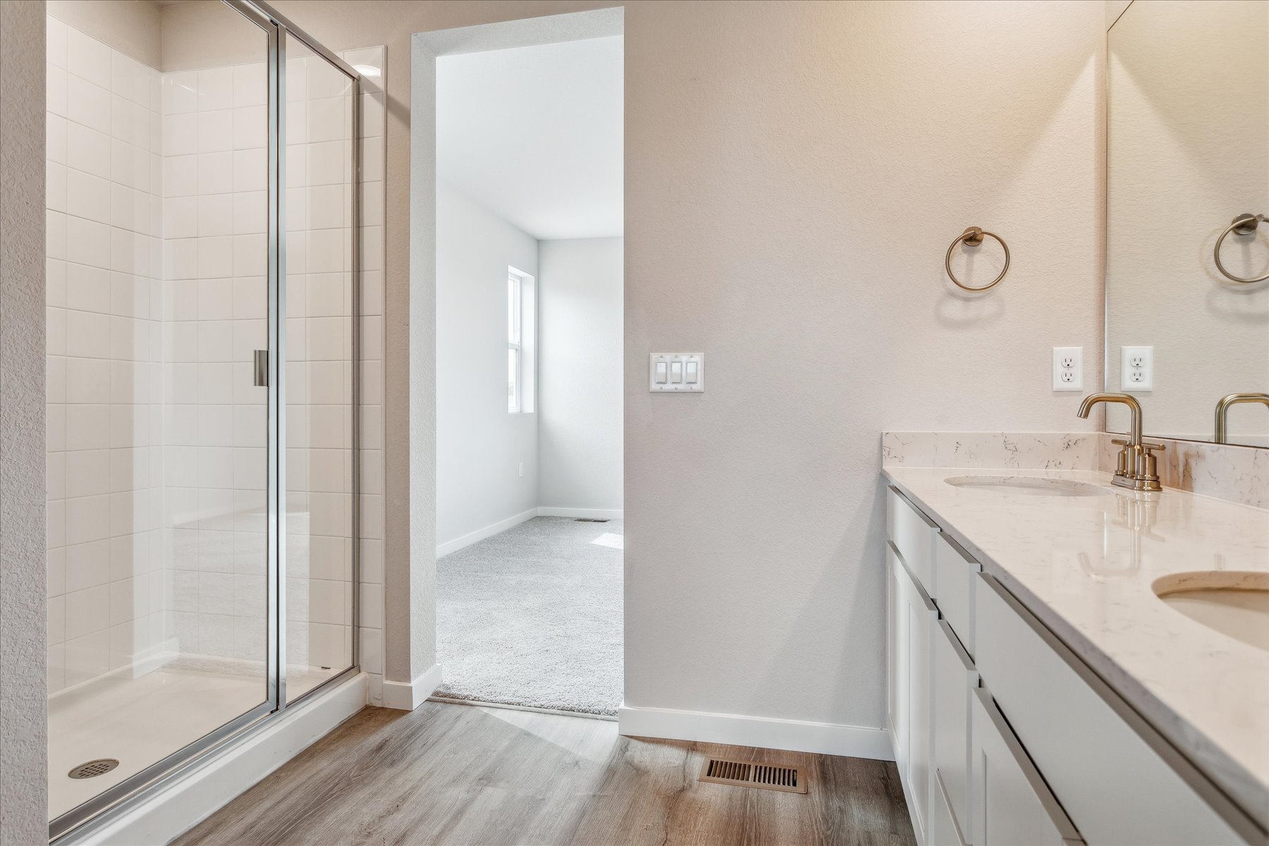 A bathroom with a glass shower.