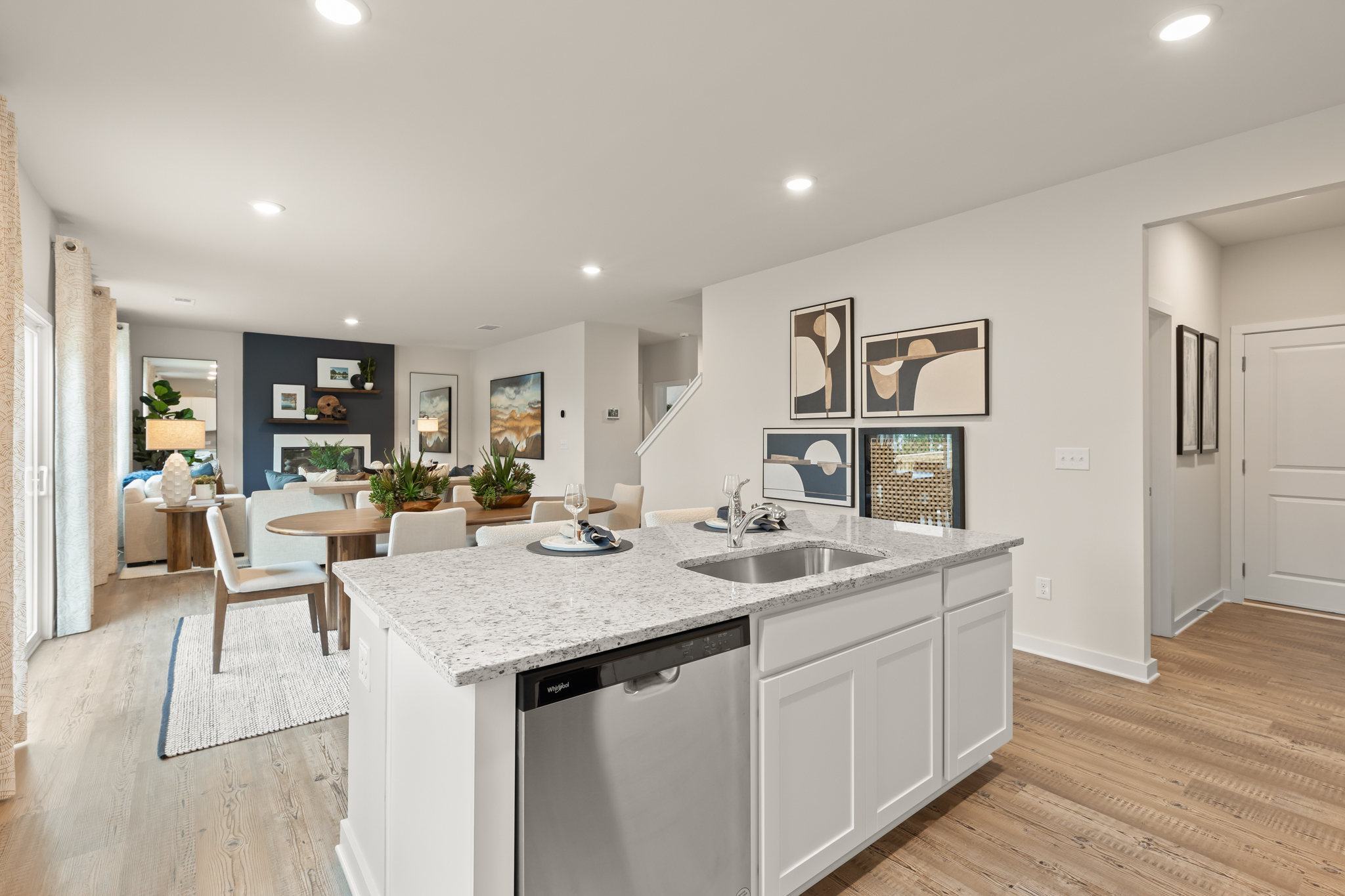 A kitchen with a marble island.