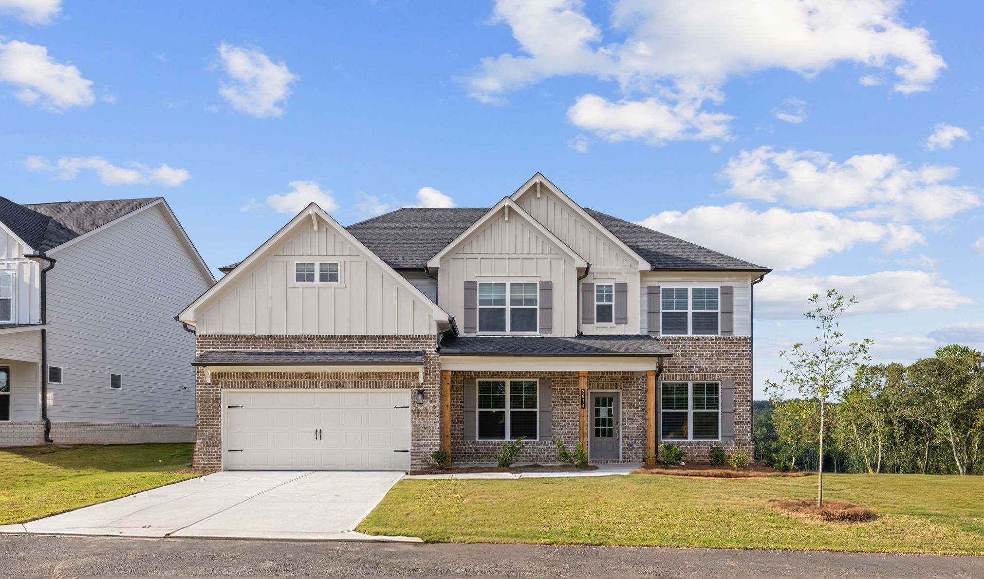 A large house with a driveway.