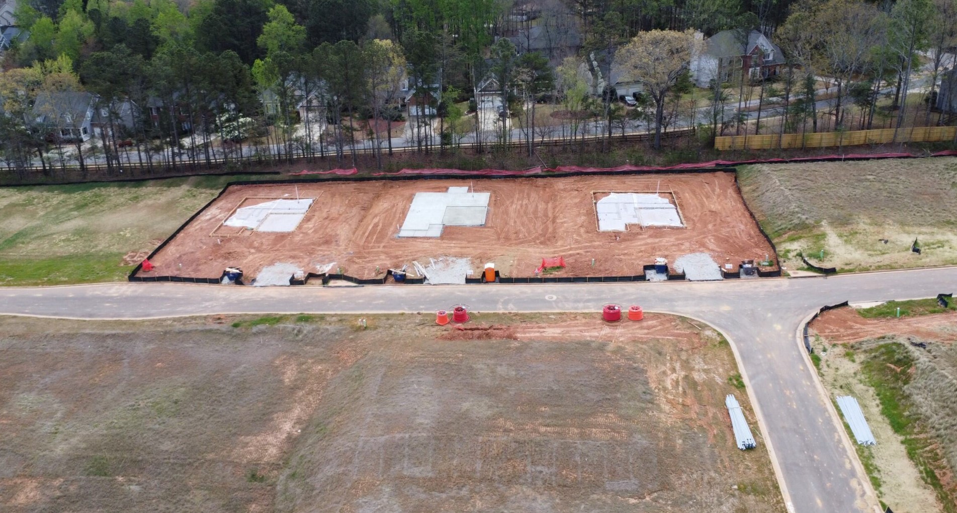A construction site with a fence.