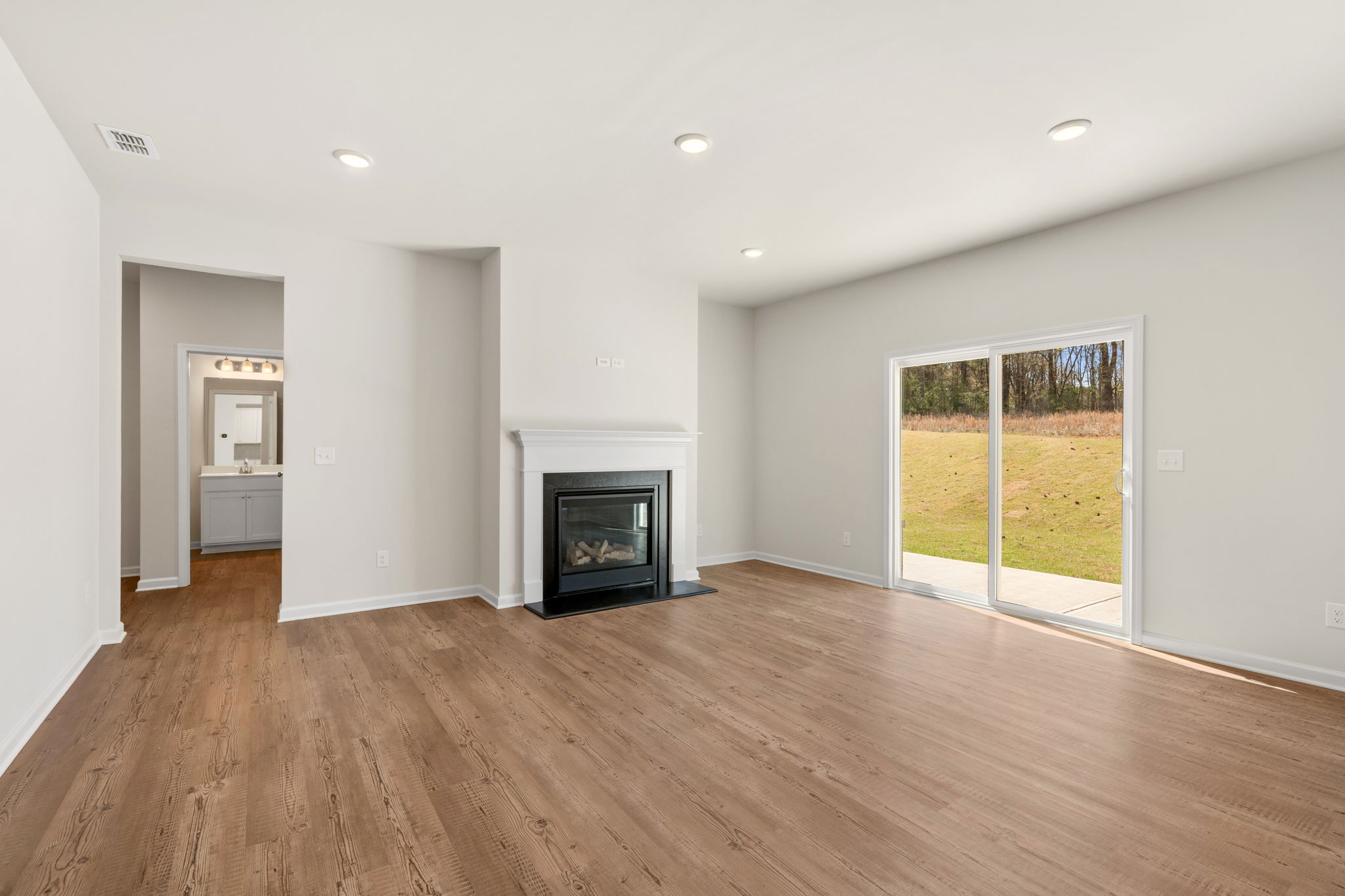 A living room with a fireplace.