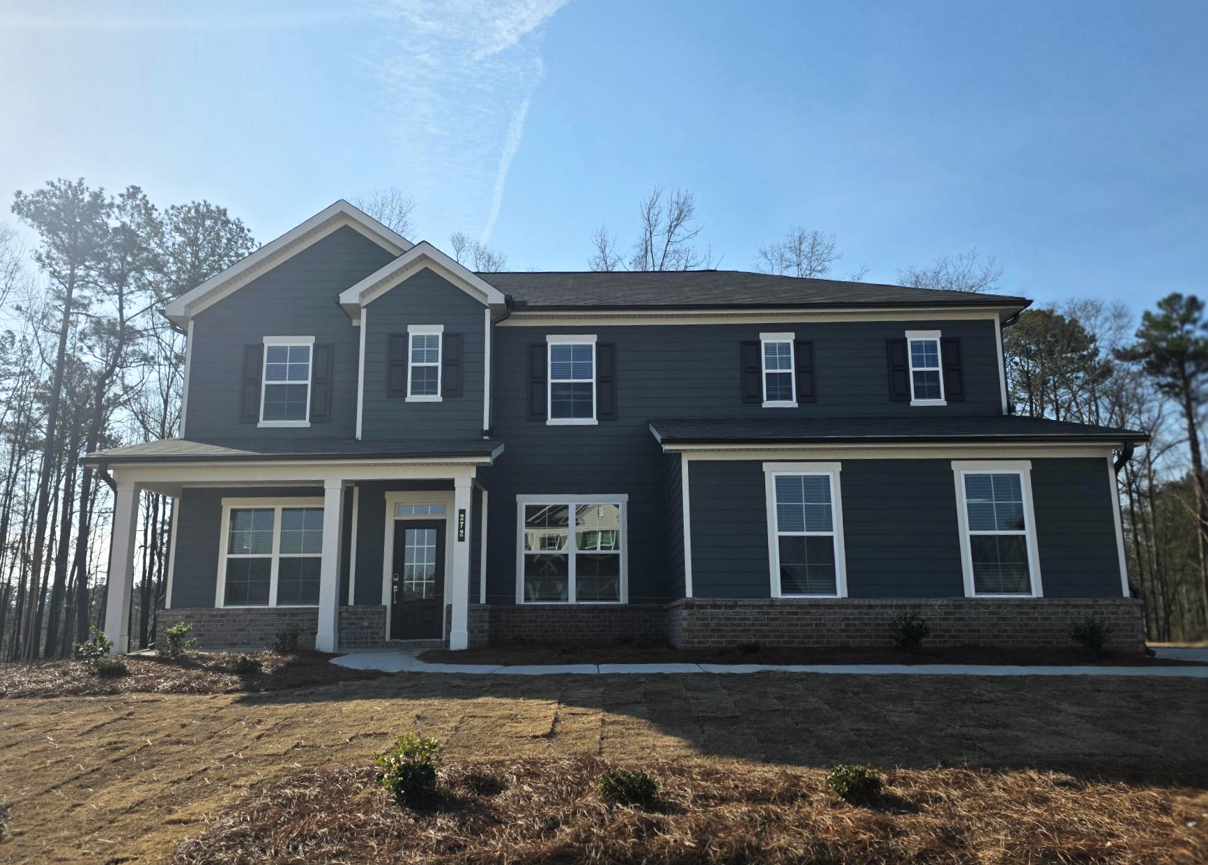 A house with a brick driveway.