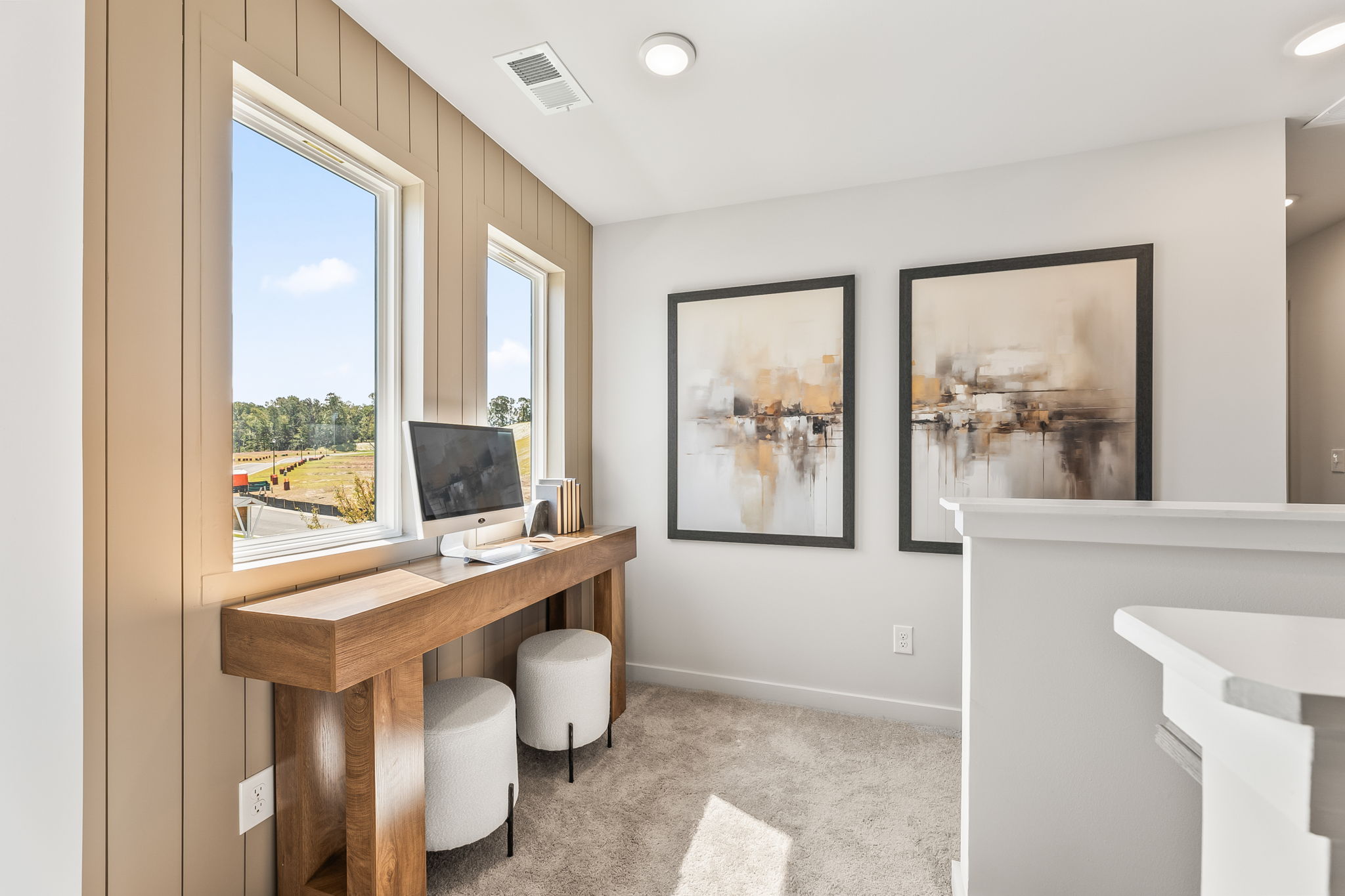 A room with a desk and a window.
