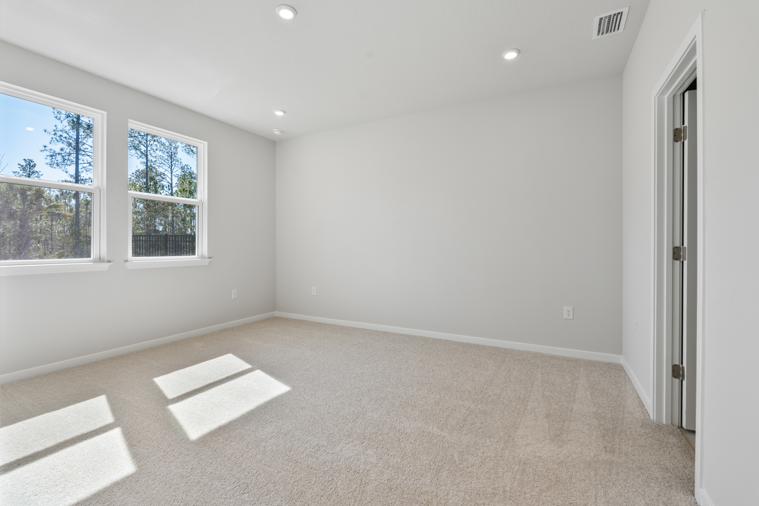 Lot 151 Primary Bedroom with Dual Windows at Seminole Palms