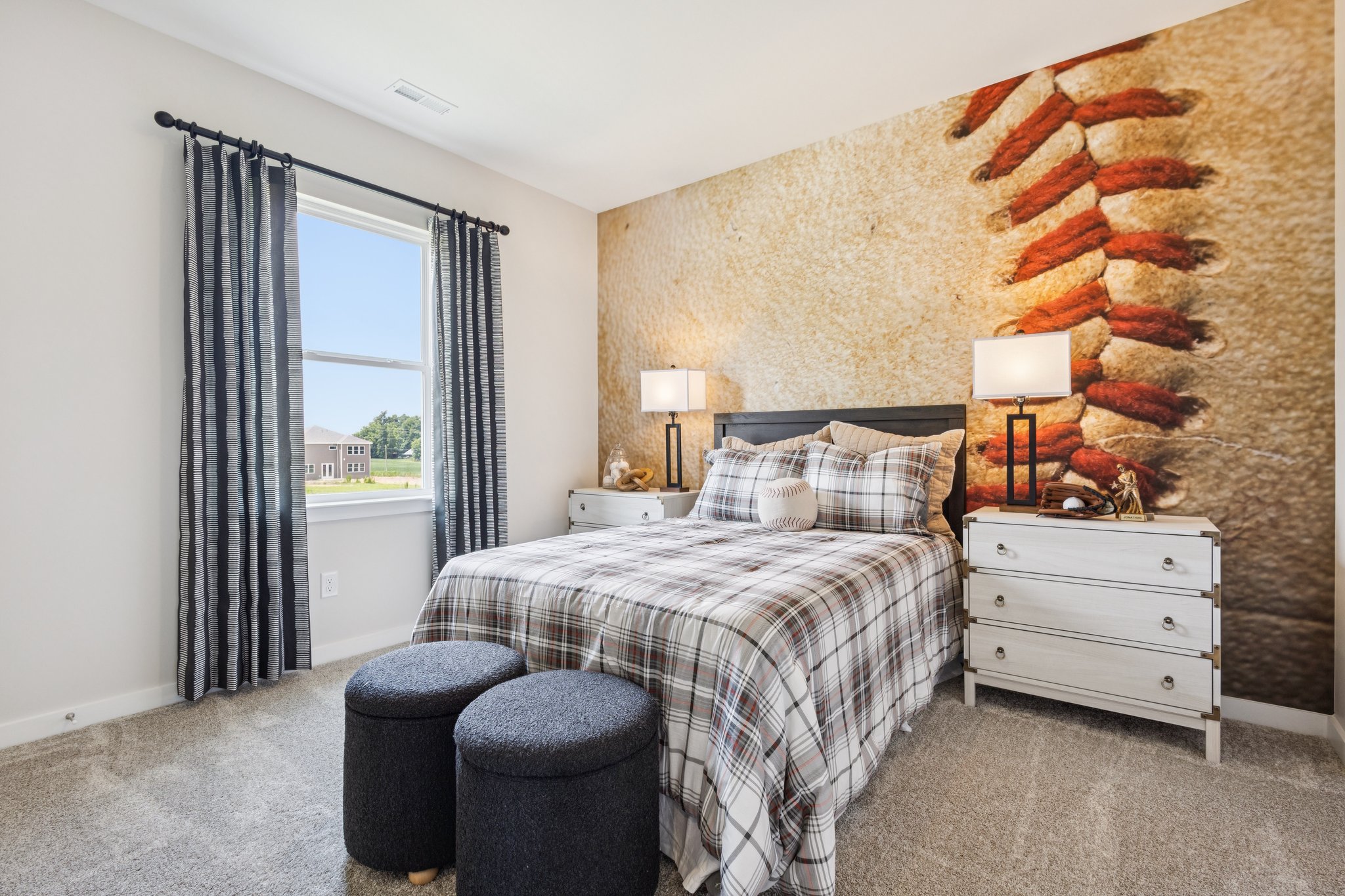 A bedroom with a bed and a window.