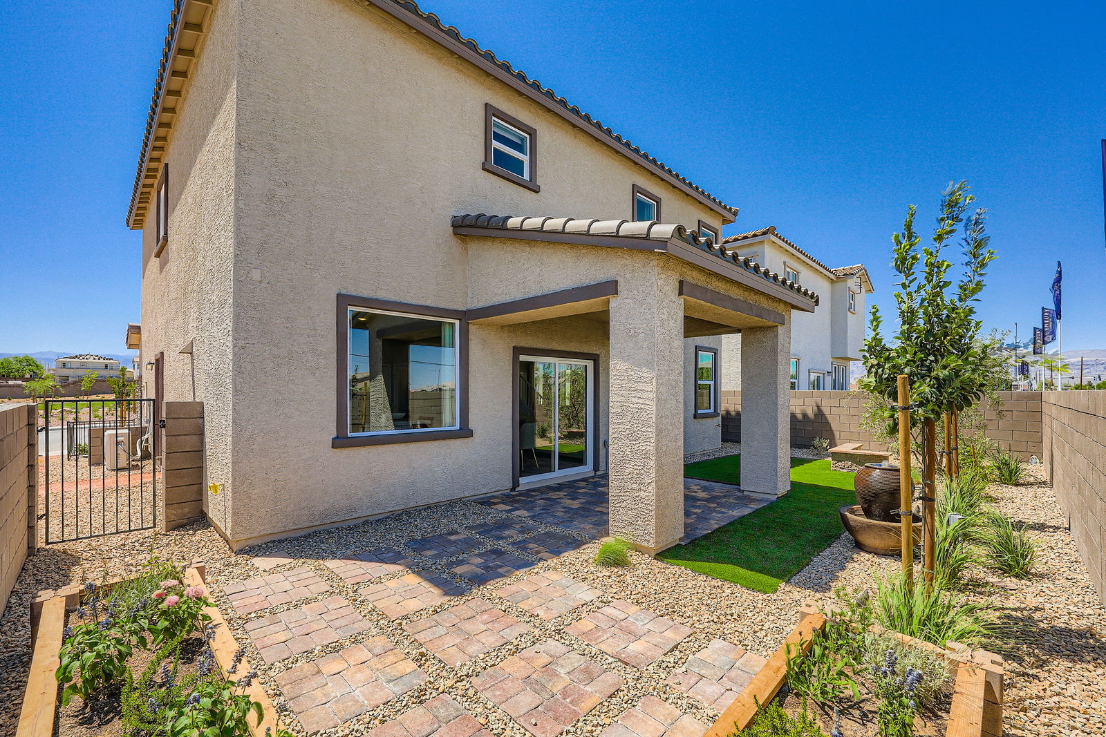 A house with a brick driveway.