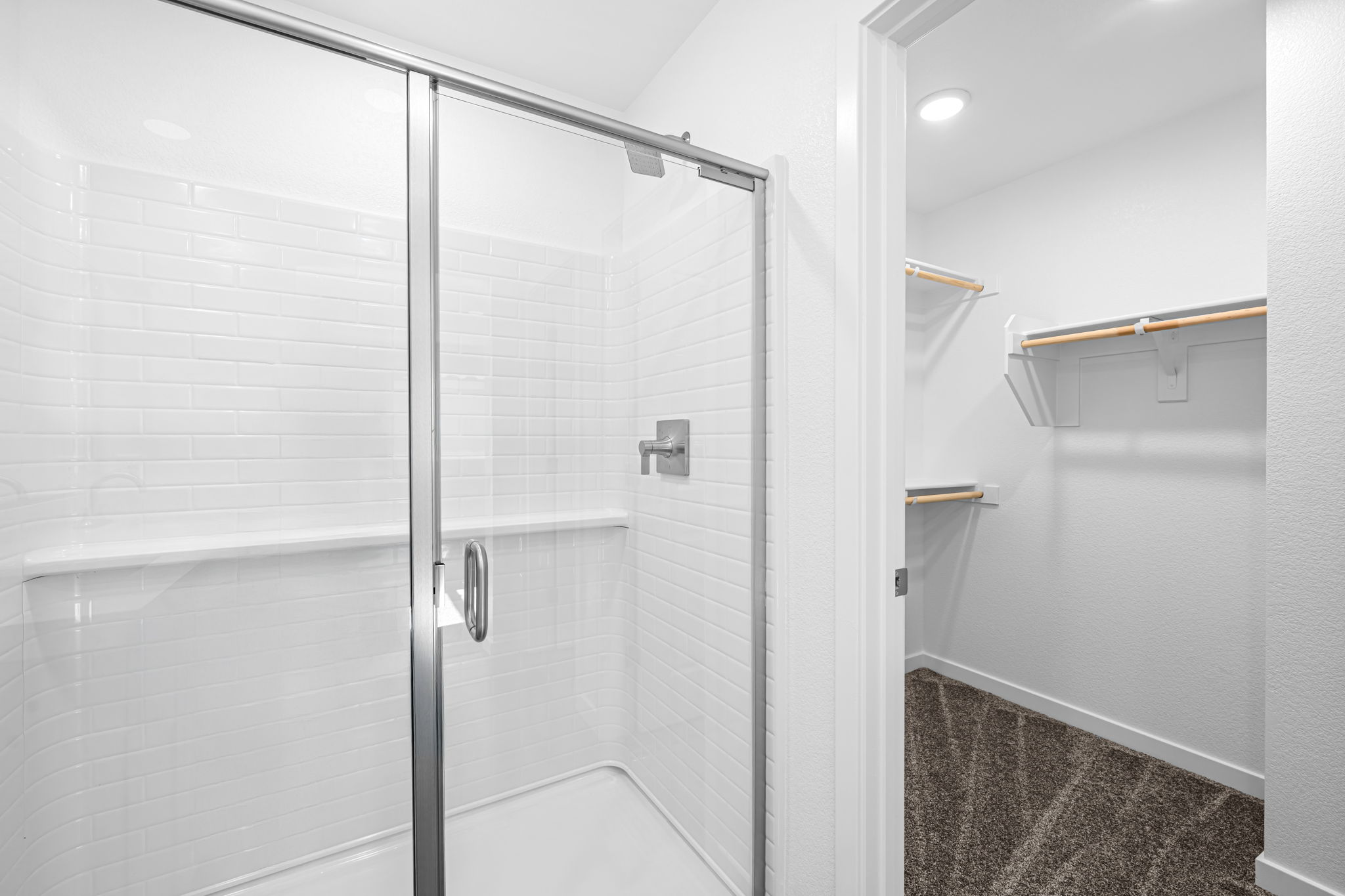 A shower with a glass door.