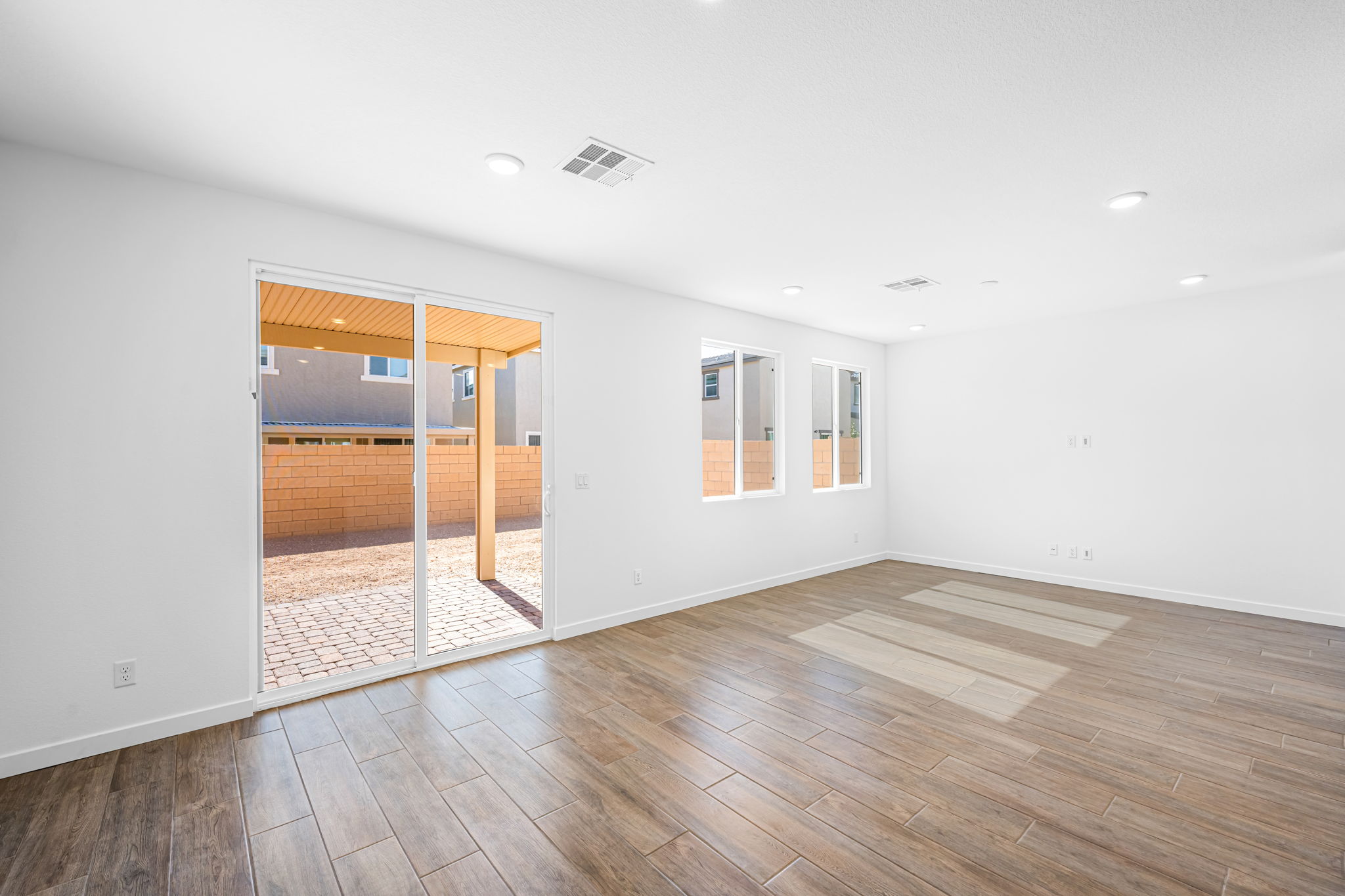 A room with a wood floor and a wood floor.