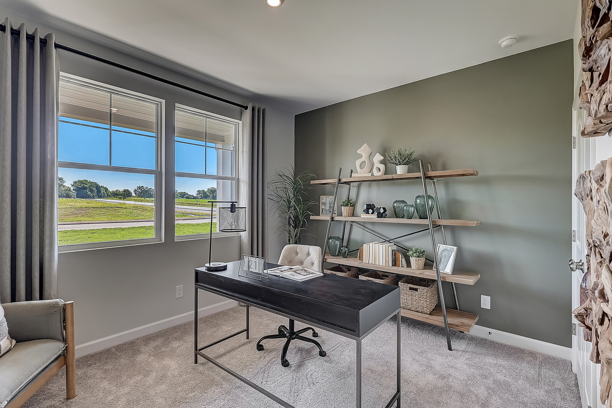 A room with a table and shelves.