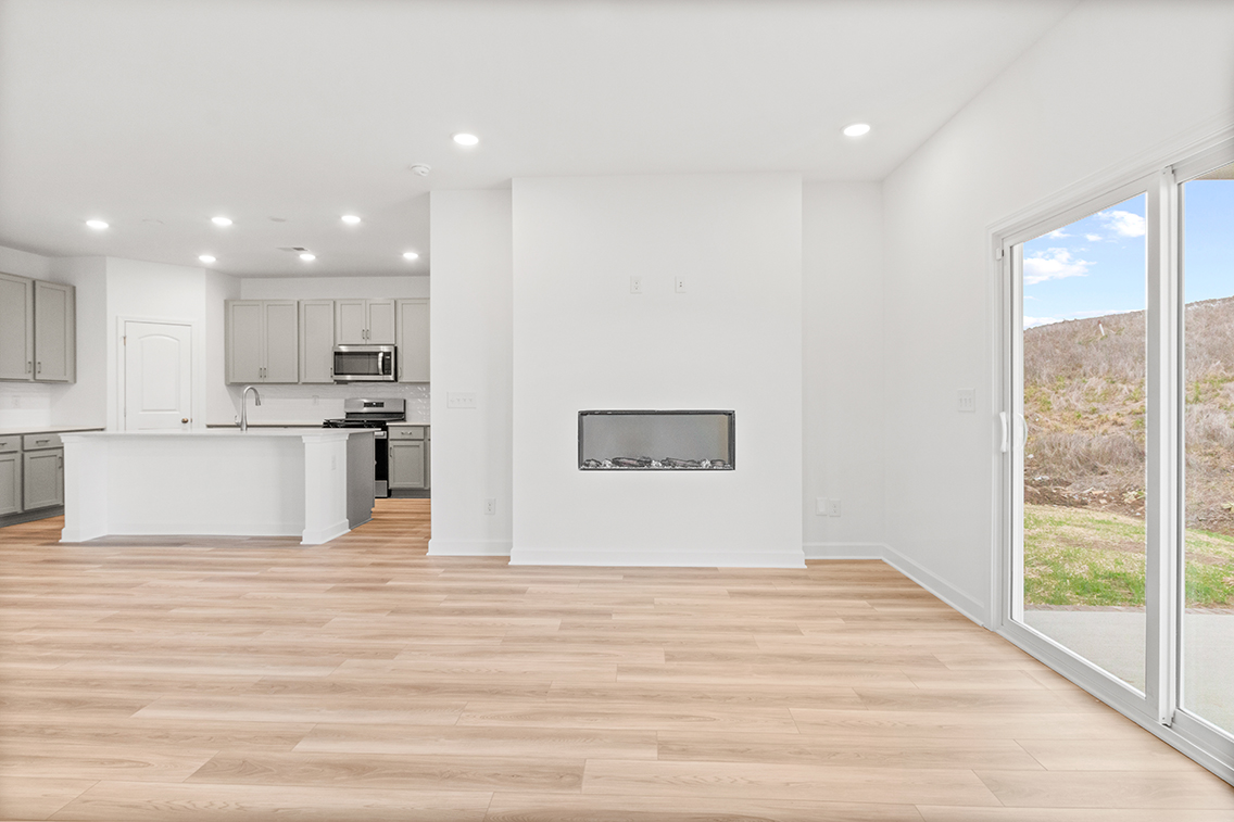 A kitchen with a wood floor.