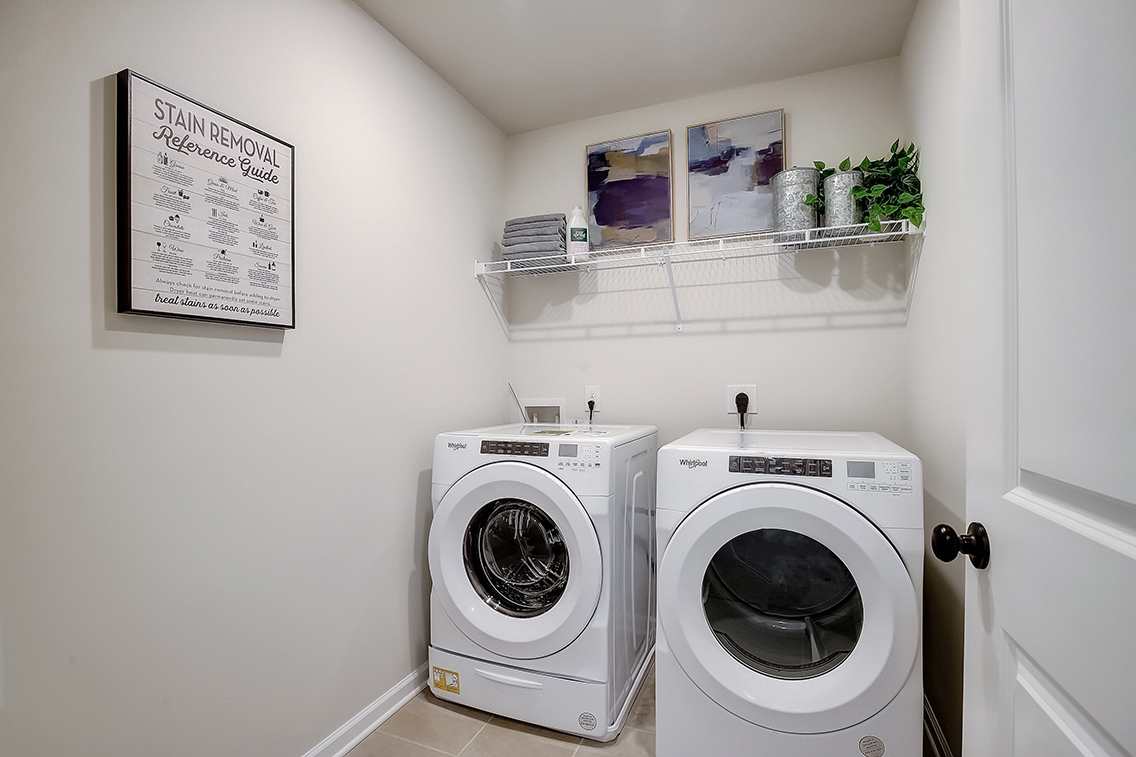 A washing machine in a room.