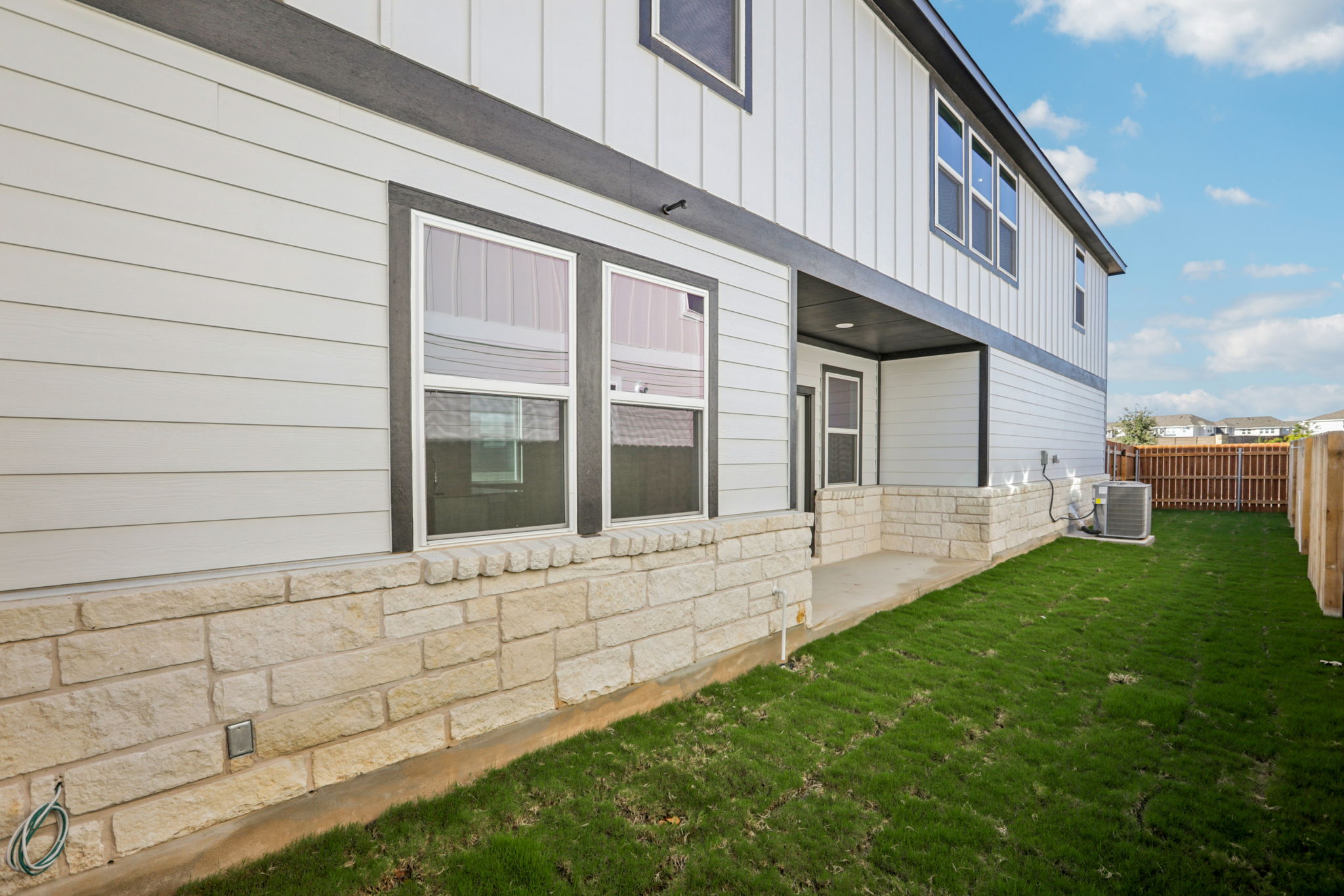 A house with a stone wall.