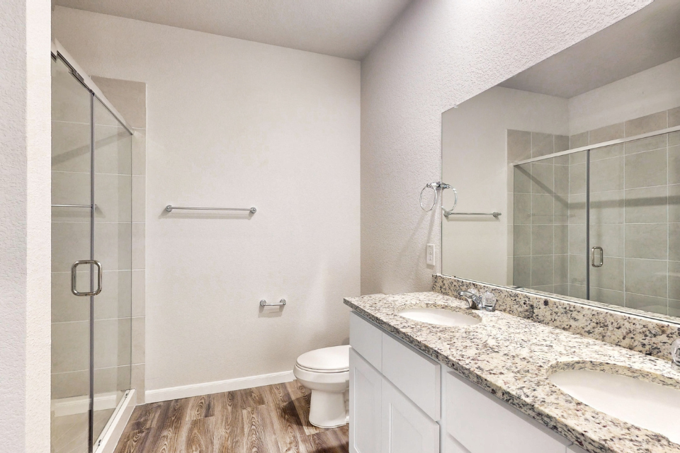 A bathroom with a marble countertop.