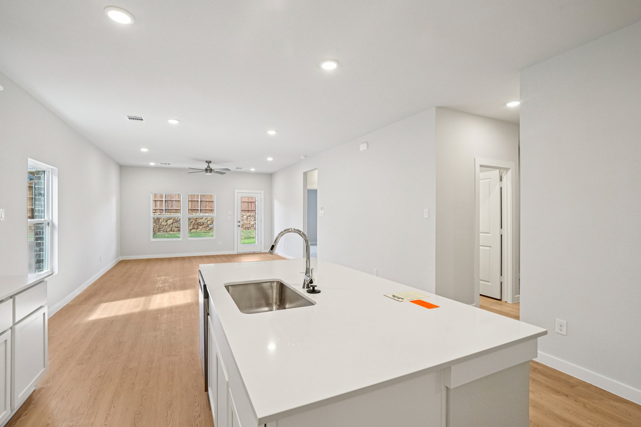 A kitchen with white walls.