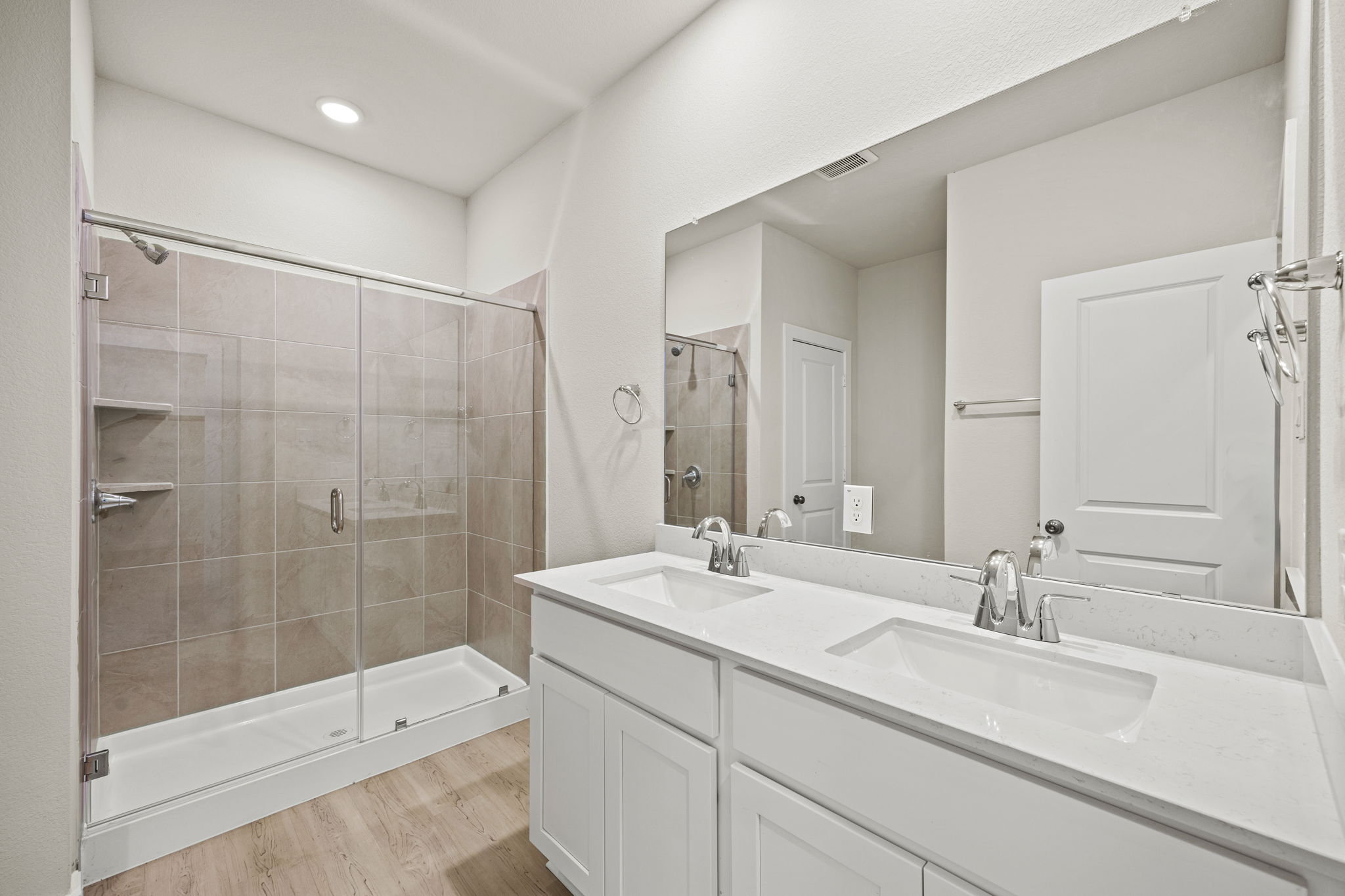 A bathroom with a glass shower.