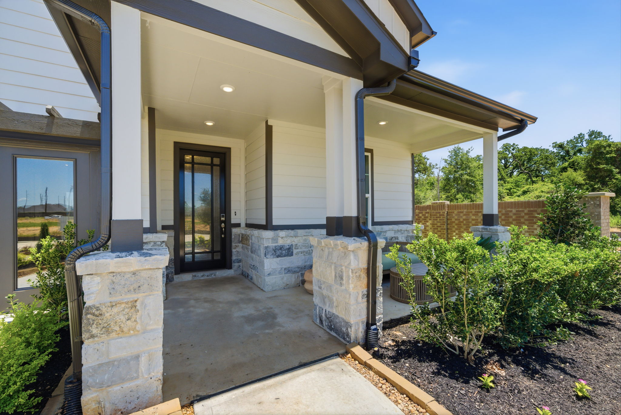 A house with a stone patio.