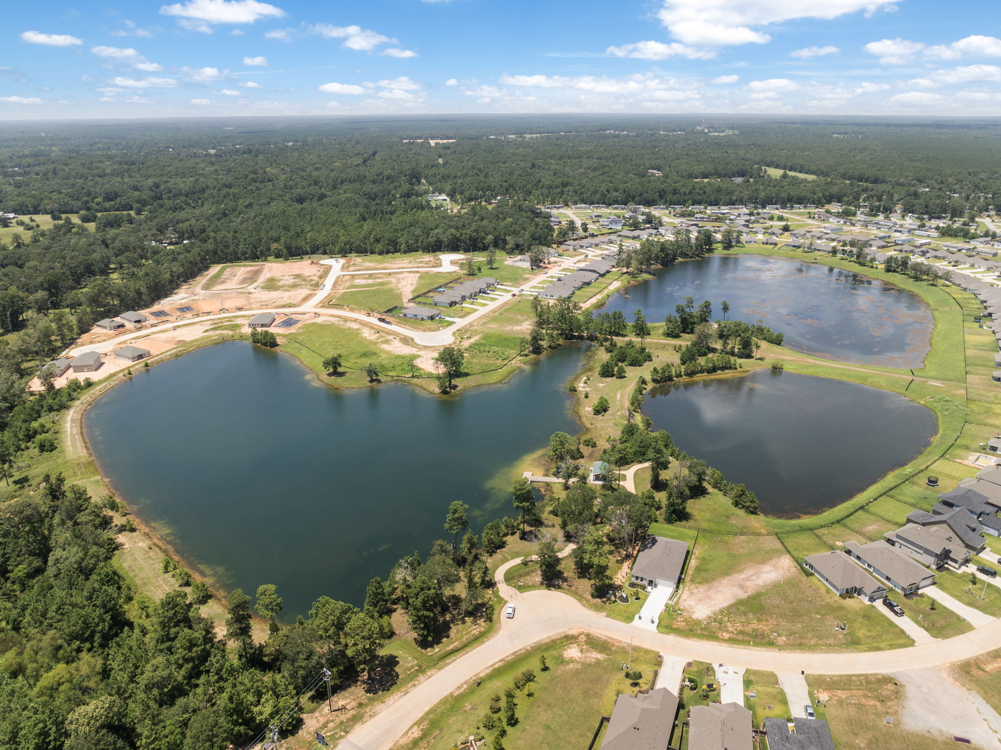 A river with a bridge and trees.