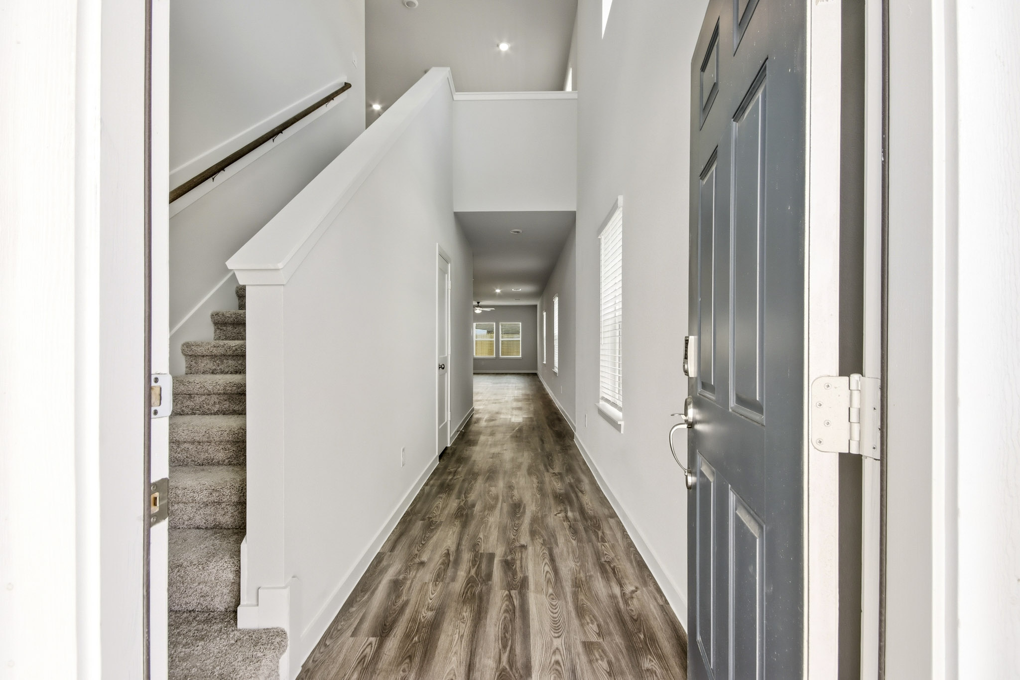A hallway with white walls.